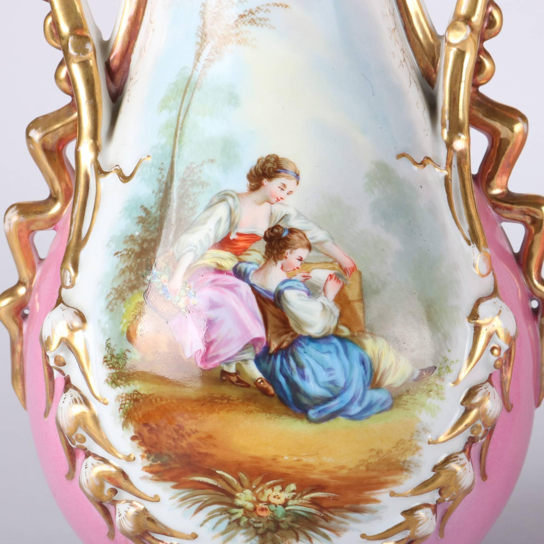 Pair of antique Old Paris porcelain portrait vases feature reserves with hand-painted courting scenes in countryside setting, gilt decorated double handles and ruffle rims, 19th century

Measure - 14