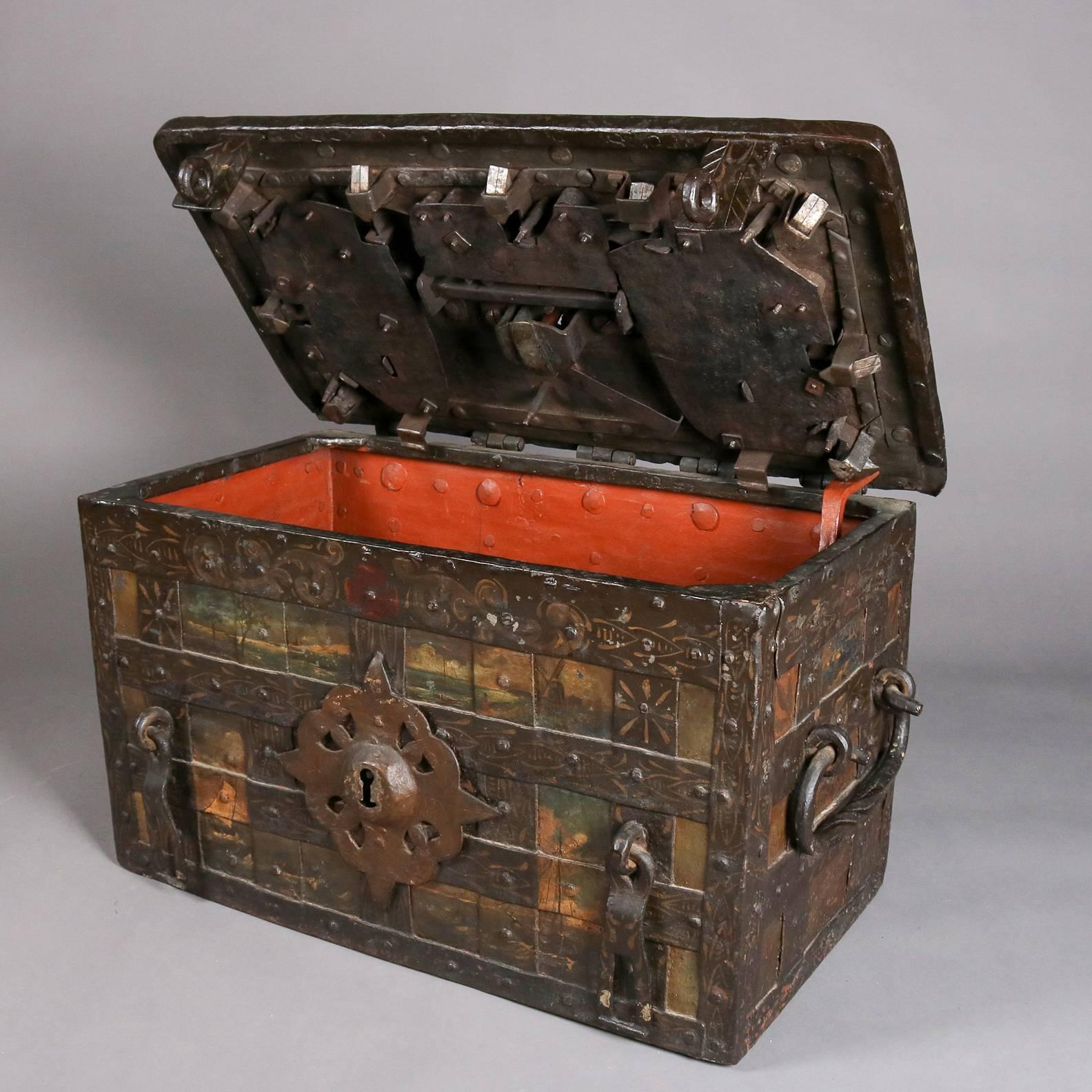 18th century antique pirate's chest features hand-forged iron construction with elaborate locking mechanism, hand-painted nautical maritime scenes include tall mast ships, floral and foliate, interior compartment with smaller locking box, keys