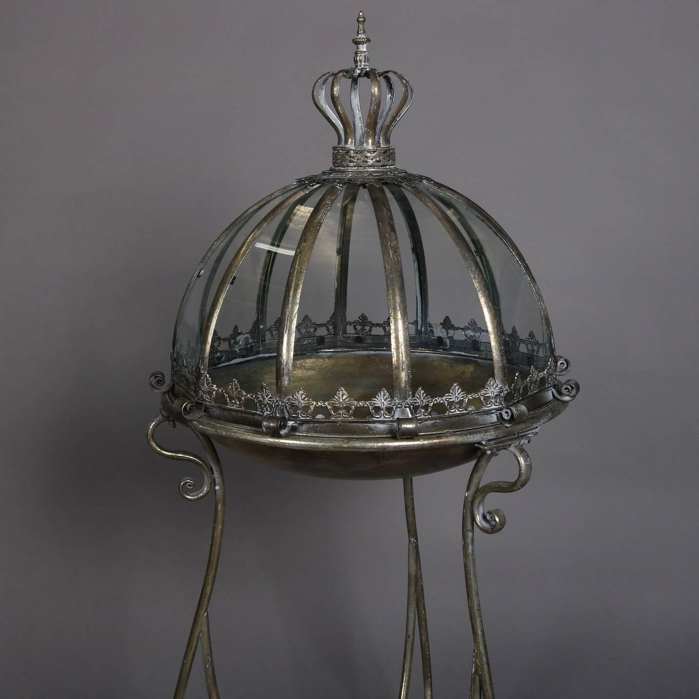 large glass and metal dome terrarium