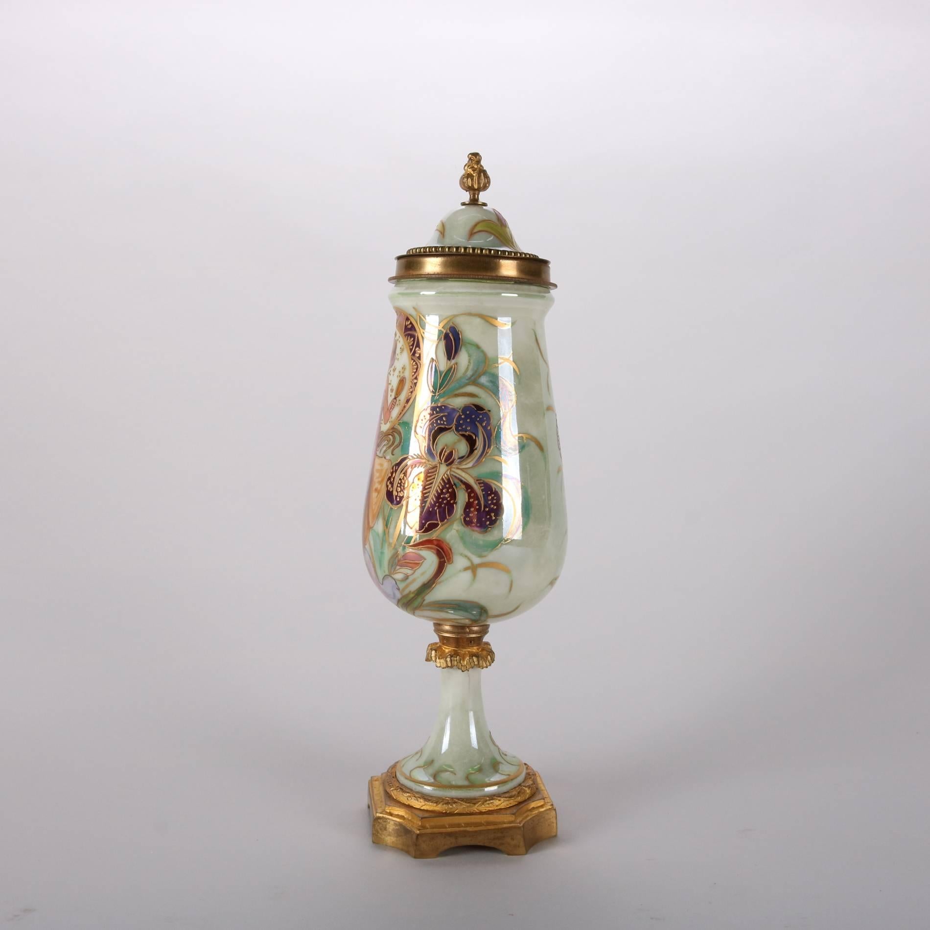 Antique French Art Nouveau petite porcelain lidded urn features hand painted portrait of woman with floral iris surround, ormolu accoutrements, artist singed Lix, Sevres crossed sword mark on base, early 20th century

Measures: 11