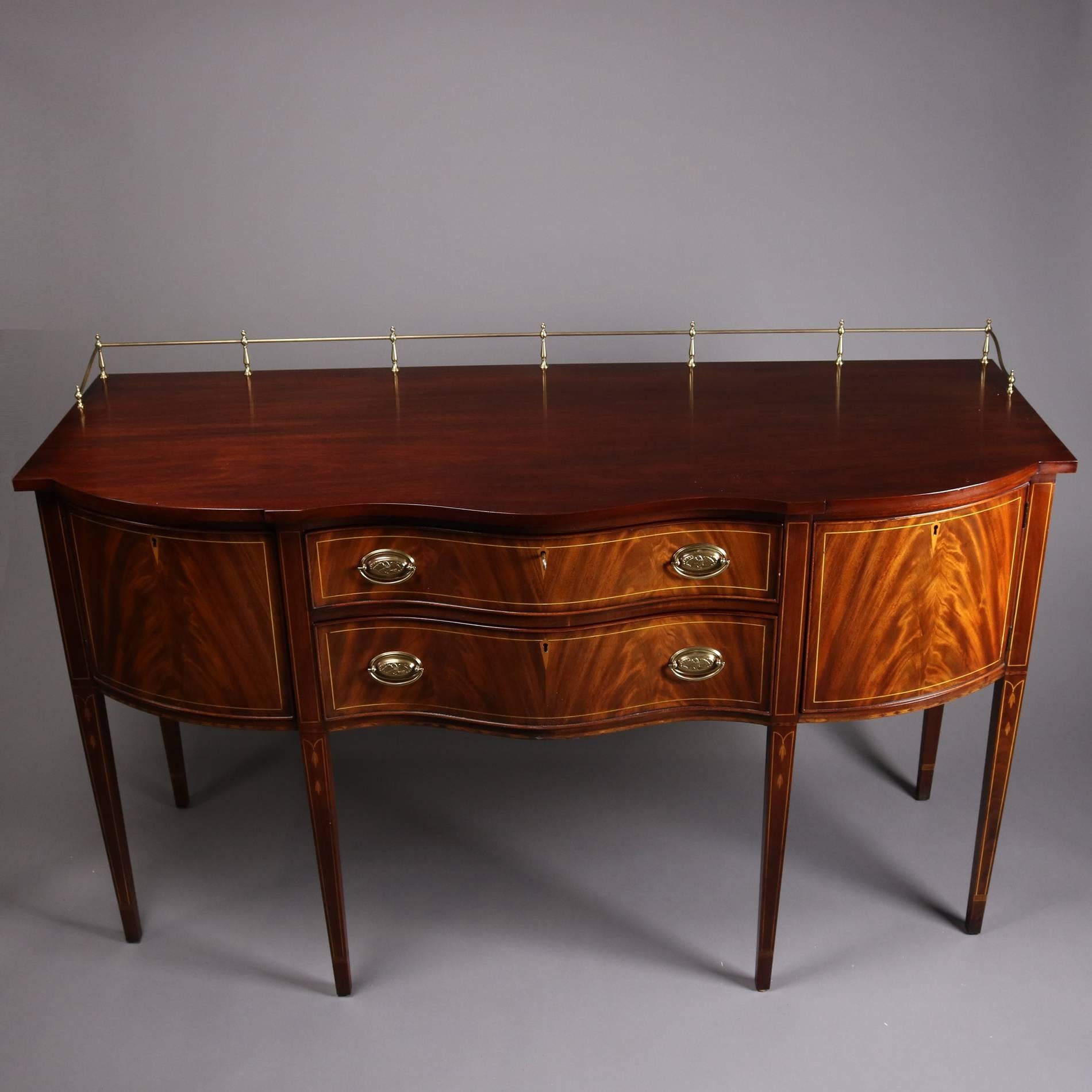 Henkel Harris locking sideboard features serpentine front, flame mahogany bookmatched drawer fronts with satinwood banding and escutcheons, with eagle pulls and gallery, Finish 29, original tag, working locks with key, 20th century

Measures -