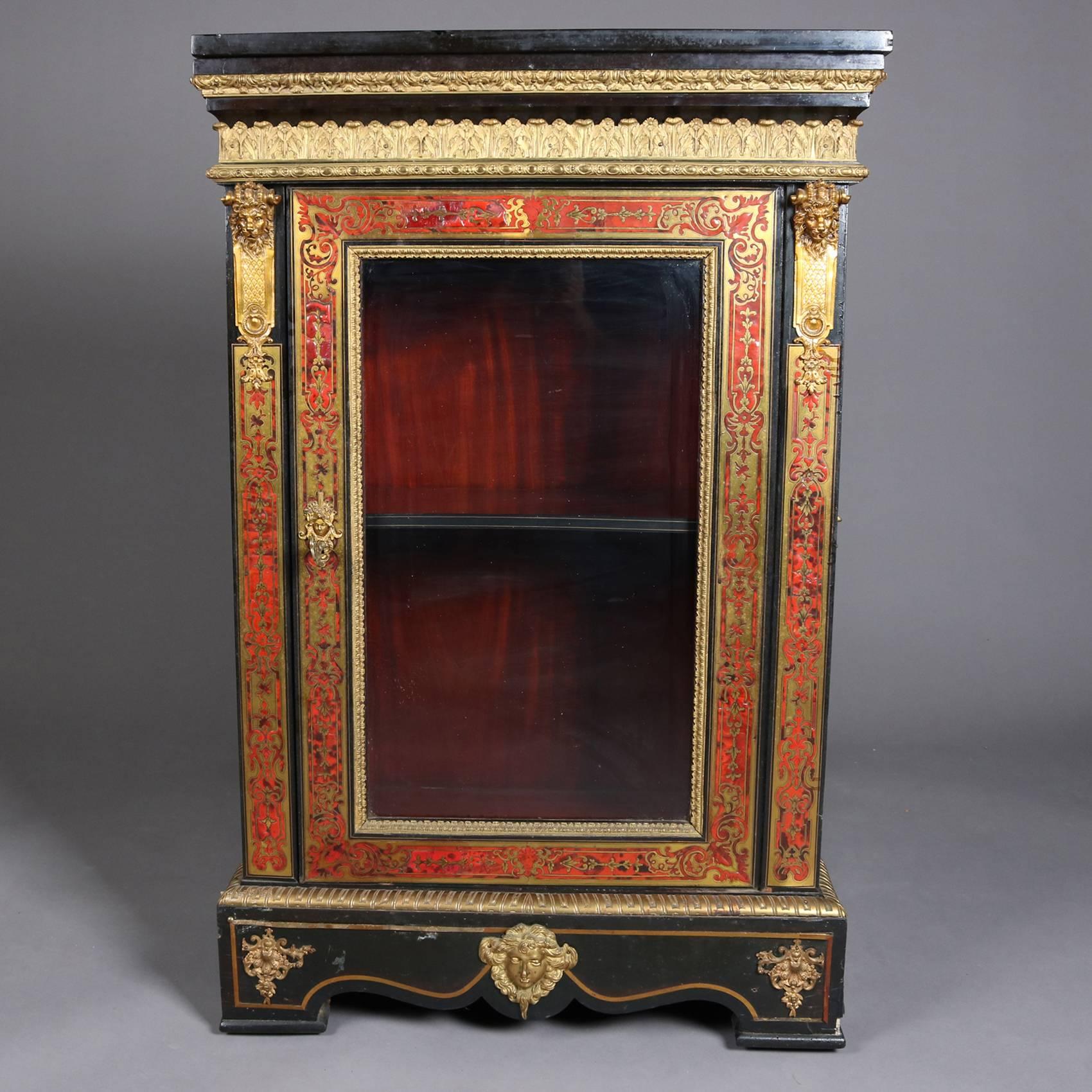 Antique French Boulle figural display cabinet features black lacquer finish with Boulle over tortoise shell face, glass front door, with ormolu trim including masks, gilt highlights, and lacquered slate top, 20th century.

Measures: 44