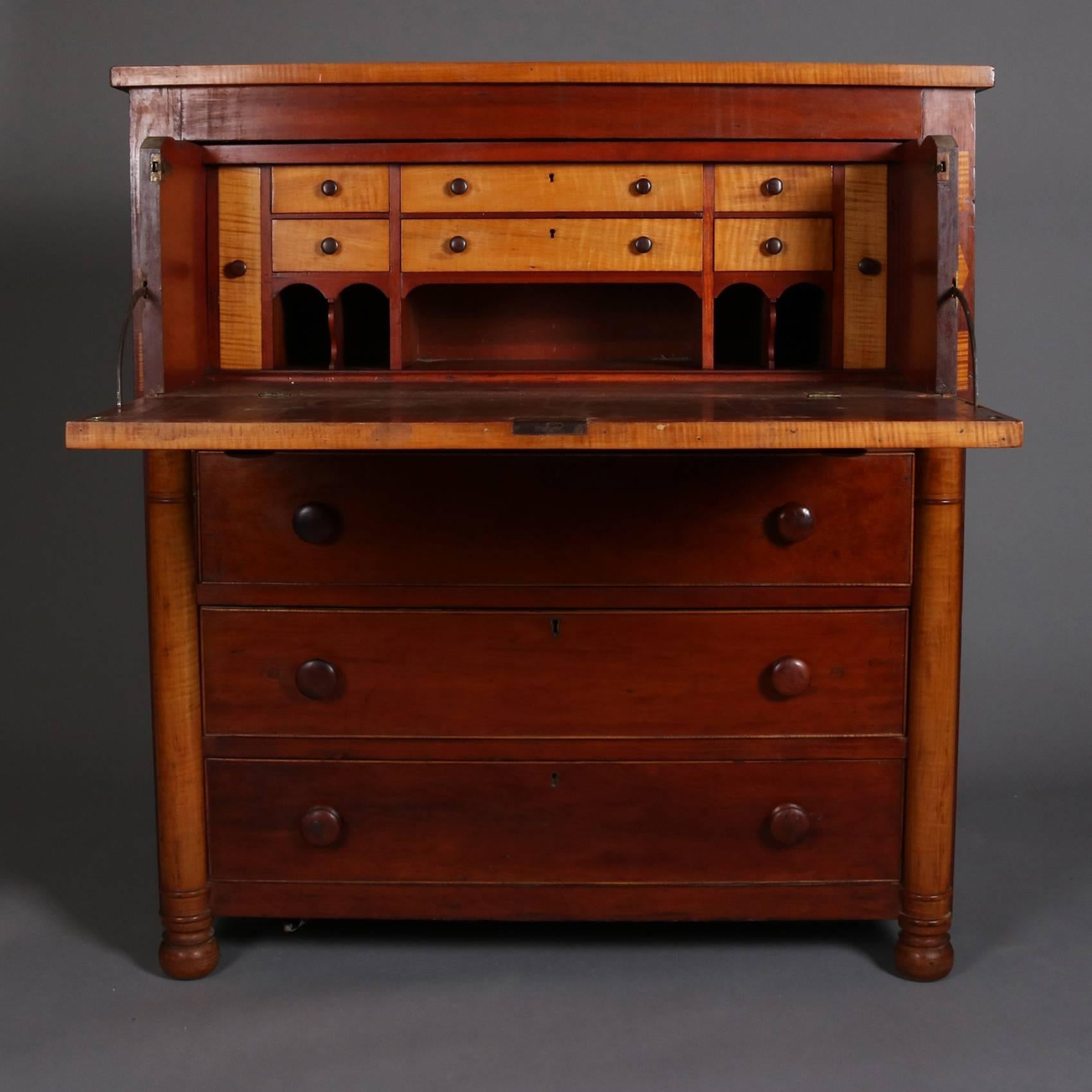 Antique Classical Empire butler's desk feature two toned inlay tiger maple with drop front  desk opening to writing surface with storage drawers and pigeon holes, lower long drawers flanked by half-columns, 19th century

Measures - 44