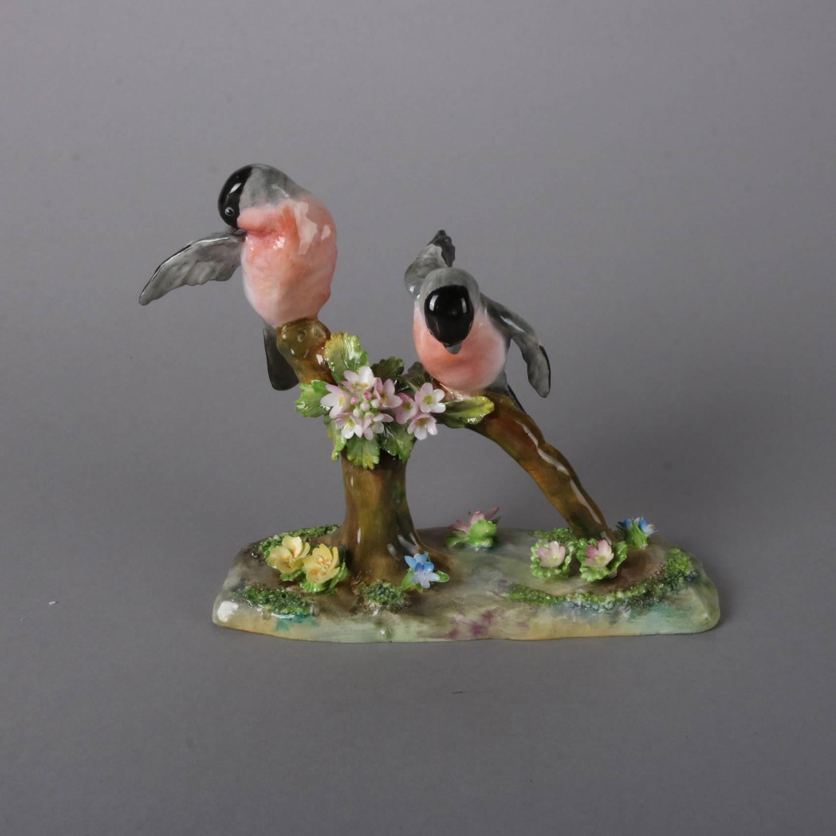 Antique English Staffordshire figurine by J. T. Jones features pair of hand-painted Eurasian Bullfinches preening on branch, signed on base, 20th century

Measures: 5.75" H x 7" W x 3" D.