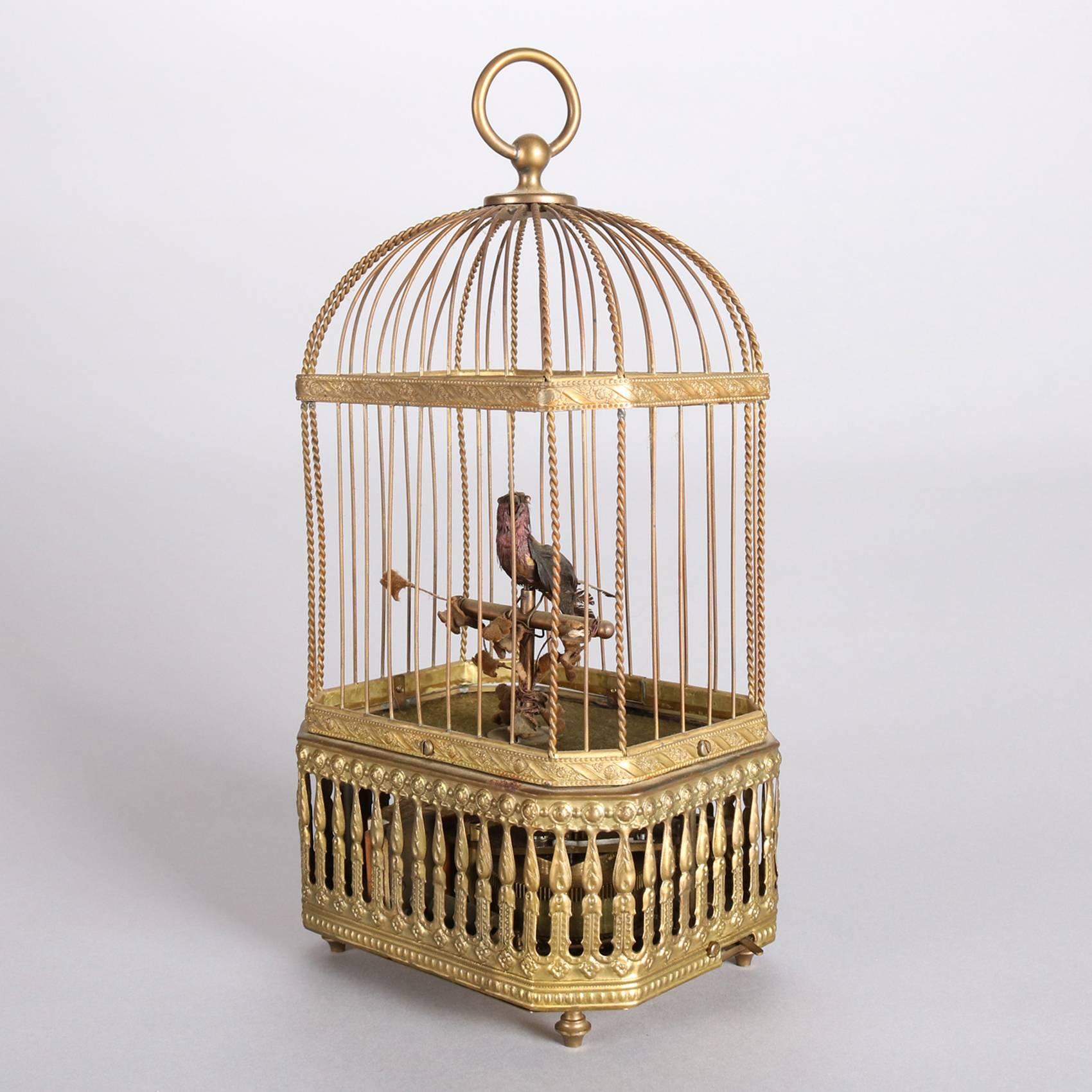 Vintage German automaton features singing and animated bird in gilt metal cage, 