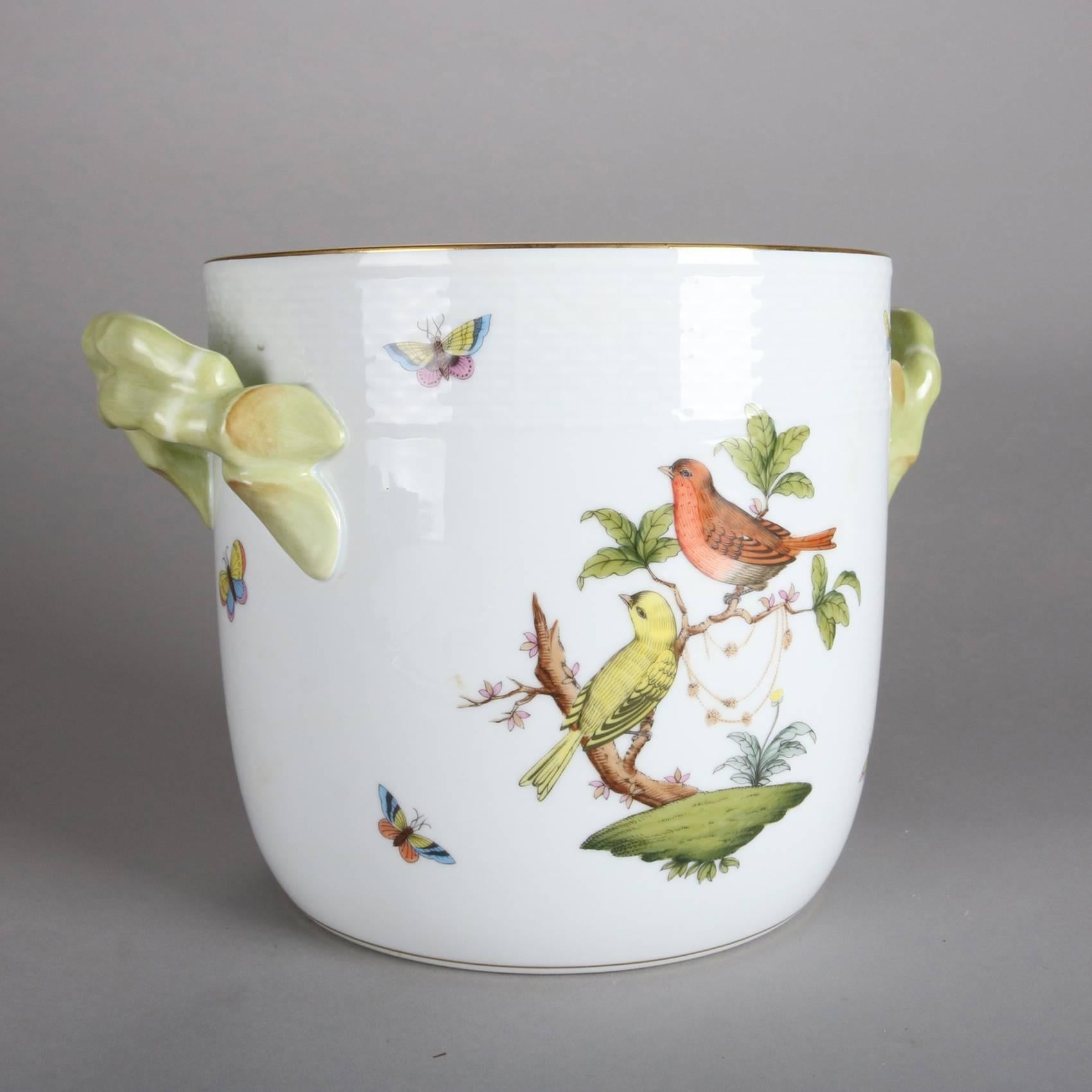 Hand-painted porcelain double handled ice bucket by Herend made in Hungary, Rothschild Bird, 20th century.

Measures: 7.25