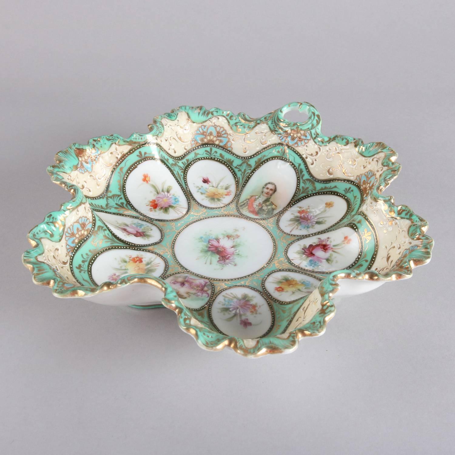 Antique Sevres School porcelain handled center bowl features ruffled form with hand-painted cameo portraits and floral reserves with gilt highlights, en verso floral decorations, 19th century

Measures - 2