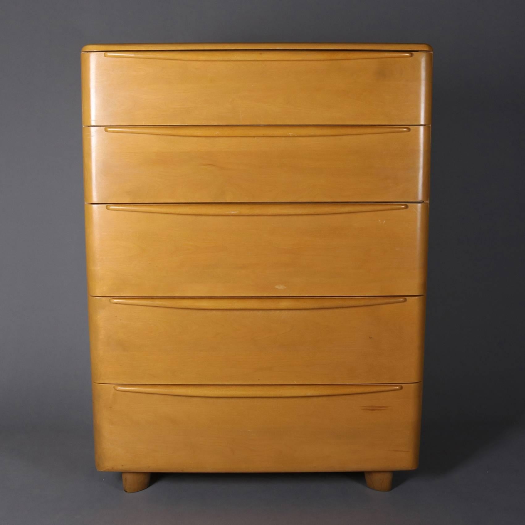 Mid-Century Modern Heywood-Wakefield Encore dresser chest of drawers features yellow birch construction with five drawers in Wheat finish, en verso maker and finish stamp, 20th century

Measures: 46" H x 34" W x 20" D.