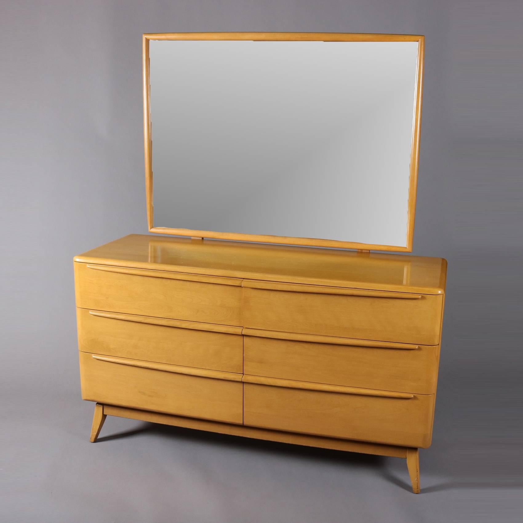 Mid-Century Modern Heywood-Wakefield Encore dresser features yellow birch construction with six drawers and mirror, finish in Wheat, marked in drawer, en verso stamped for Wheat finish, 20th century

Measures - 66.25" H x 56" W x