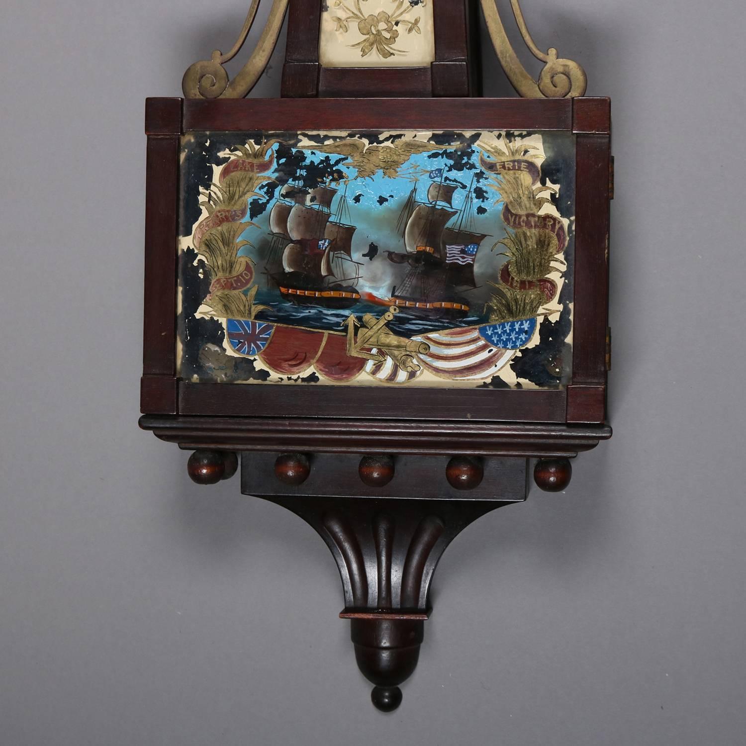 Federal style patriotic banjo wall clock features mahogany case with hand painted glass panels of seascape, central shield and eagle, signed on face J. E. Caldwell & Co., working and with key, 20th century

Measures: 32