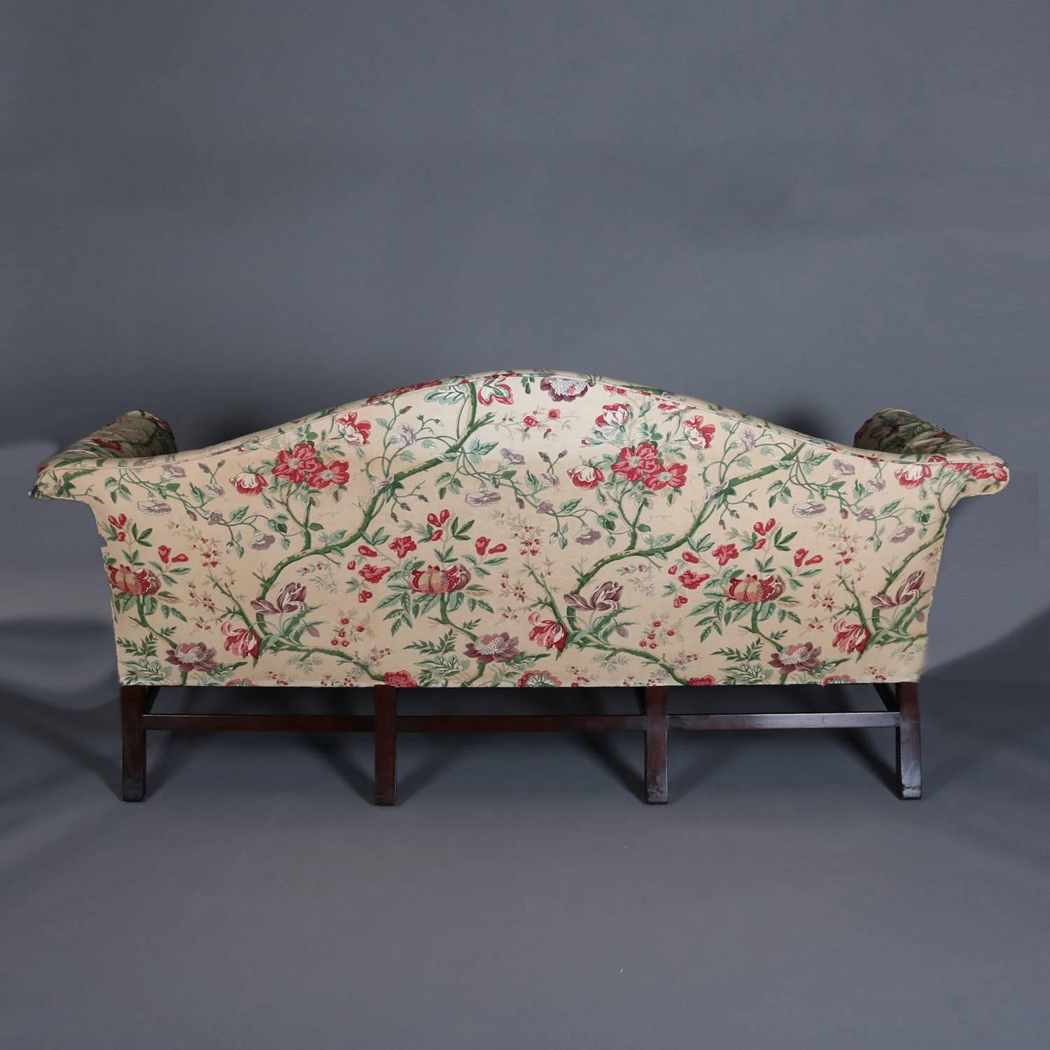 Sheraton camel back sofa features floral chintz upholstery and scroll arms, 20th century

*Matching chairs listed separately*

 Measures - 38"h x 79"w x 34"d, 20" seat height