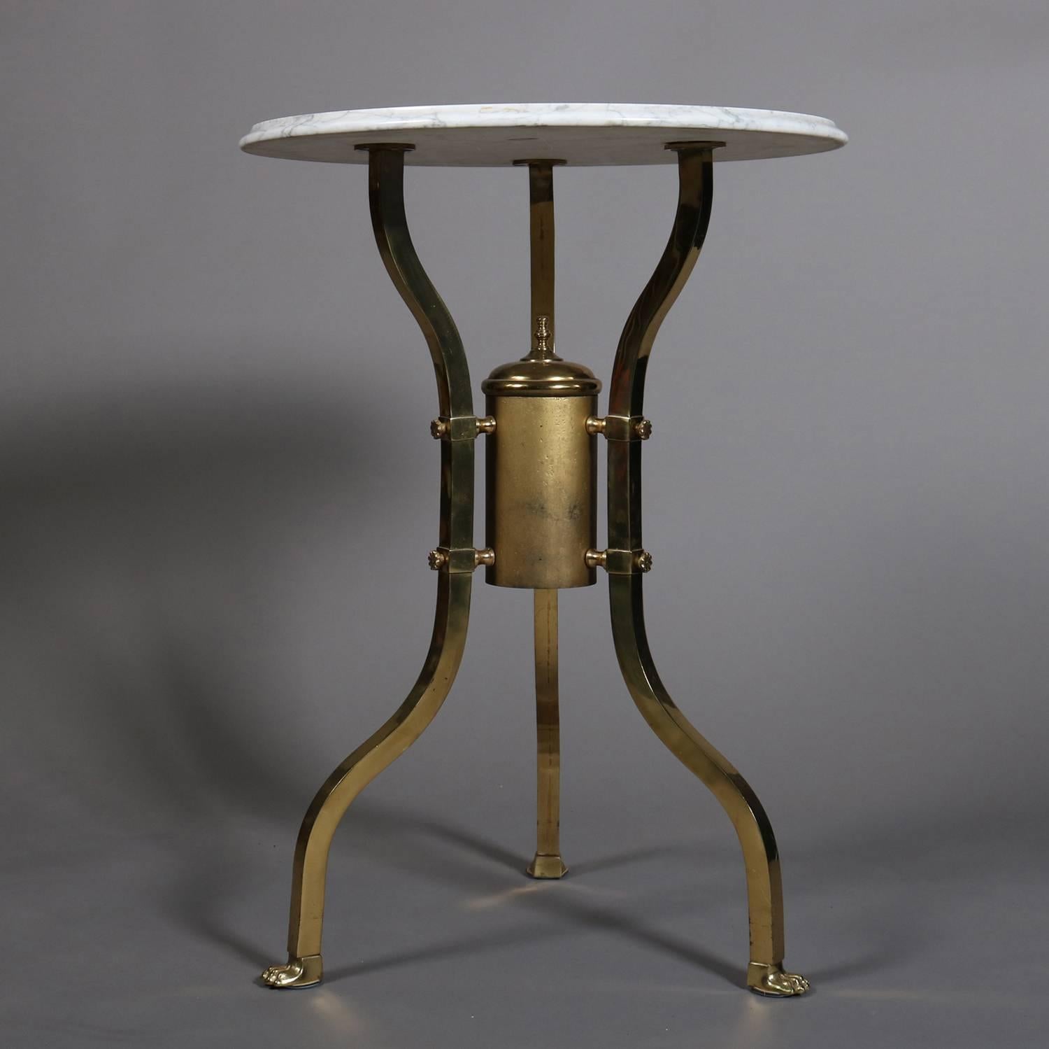 Aesthetic Movement round parlor table features brass frame, each leg seated on paw feet, Italian marble top, original 