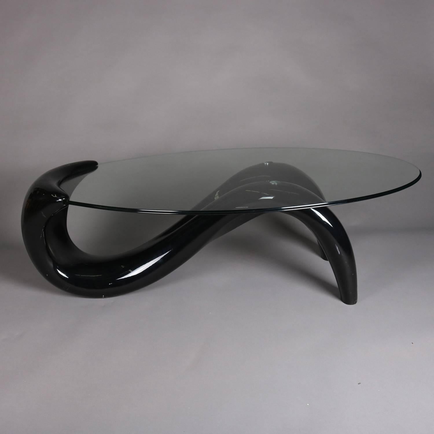 Mid Century Modern sculptural coffee table features abstract black taffy asymetrical base with heavy glass top, 20th century

Measures - 15.5