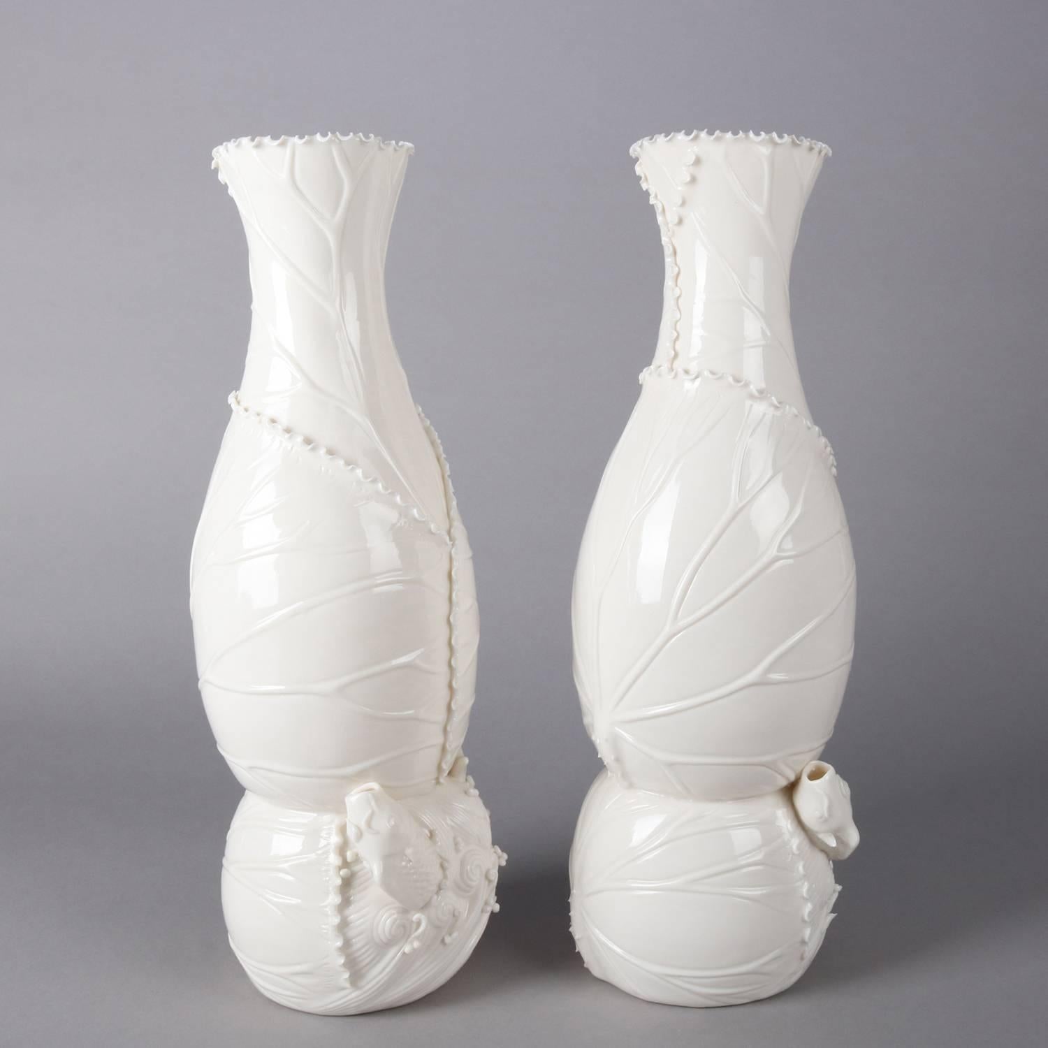 Pair of Blanc do Chine figural porcelain vases features coral reef, beach and shore motif including ocean fish and plant life and stylized waves, ruffled rims, signed on base as photographed, 20th century

Measure - 14