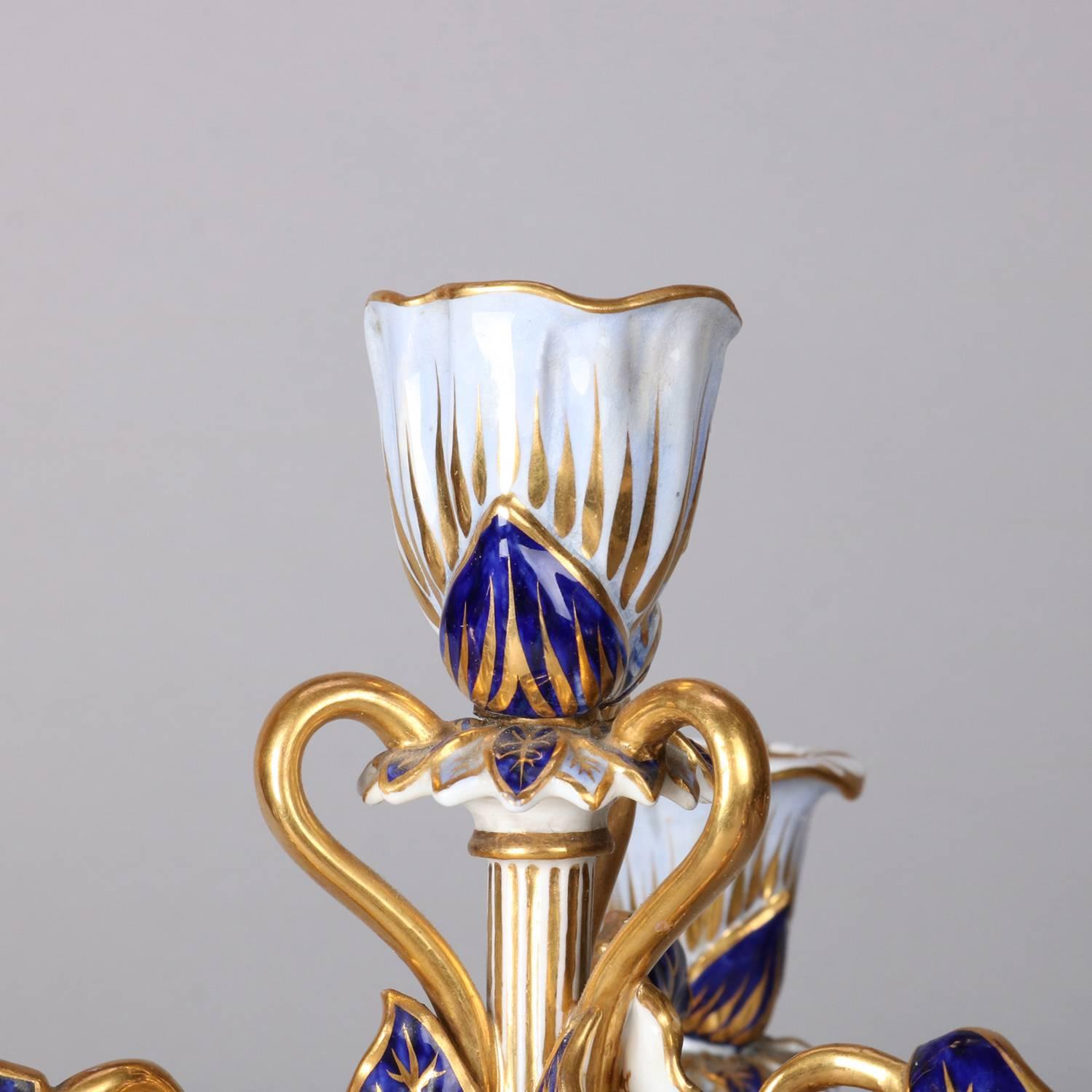 20th Century Pair of Meissen School Cobalt & Gilt Porcelain Cherub & Foliate Form Candelabra