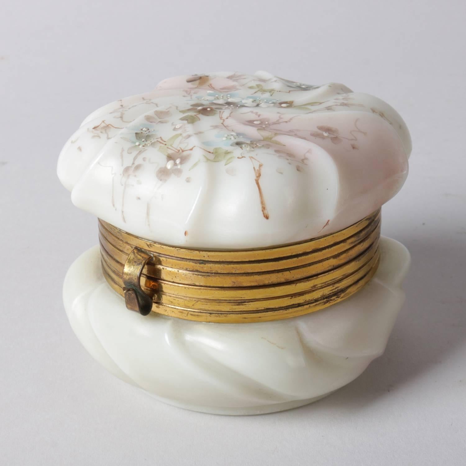 Antique wavecrest opaque art glass dresser box features hand-painted enamel flowers and gilt mounts, stamp on base, 19th century

Measures: 2.75