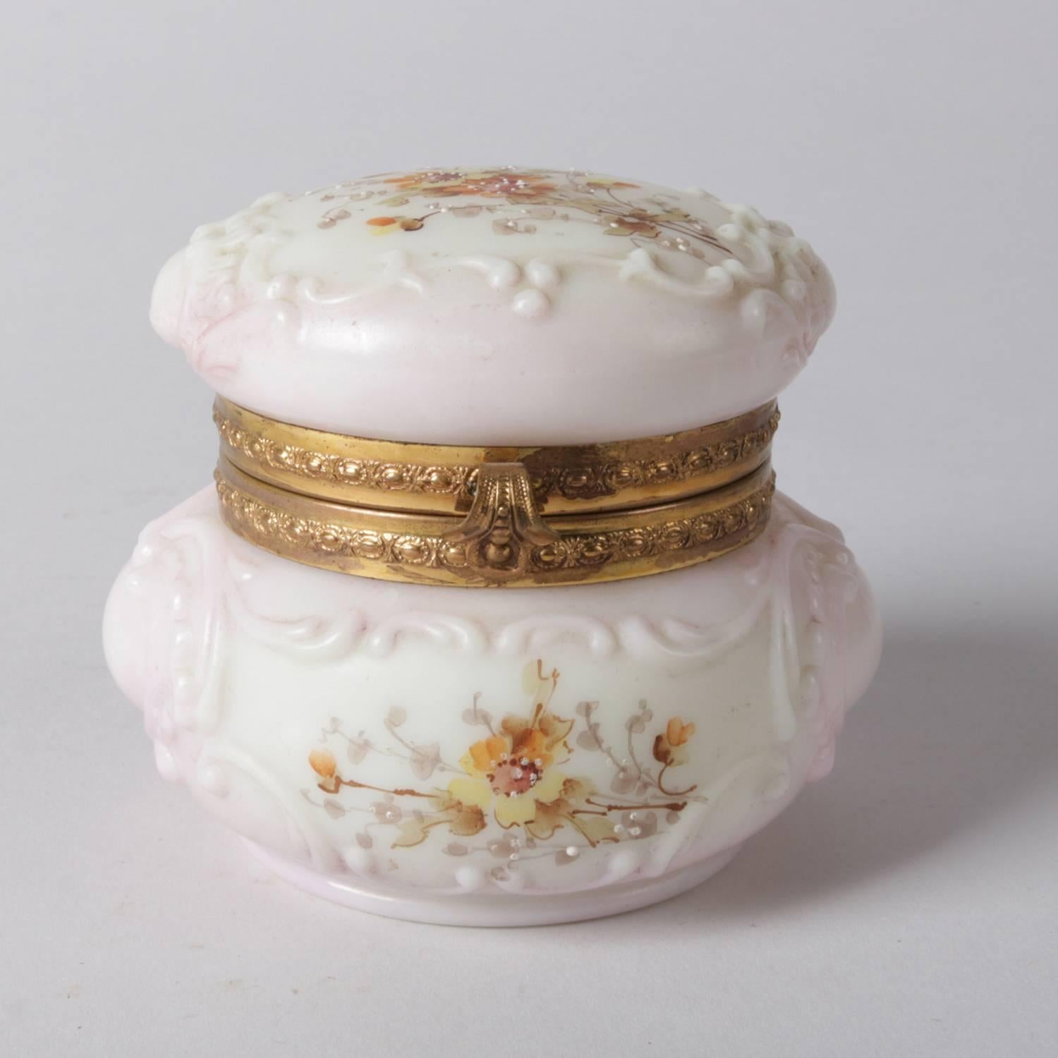 Antique Wavecrest opaque pink art glass dresser box features embossed scroll decoration with hand painted enamel flowers and gilt mounts, stamp on base, 19th century

Measures: 3.5