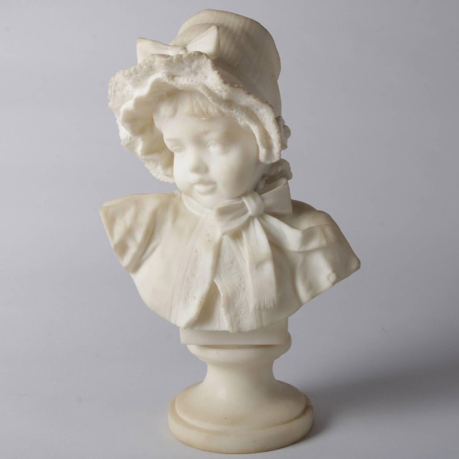 Italian Lapini School well executed and highly detailed Victorian carved marble bust depicts young girl with bonnet, bow, and lace trimmed cape, 19th century

Measures: 14.5