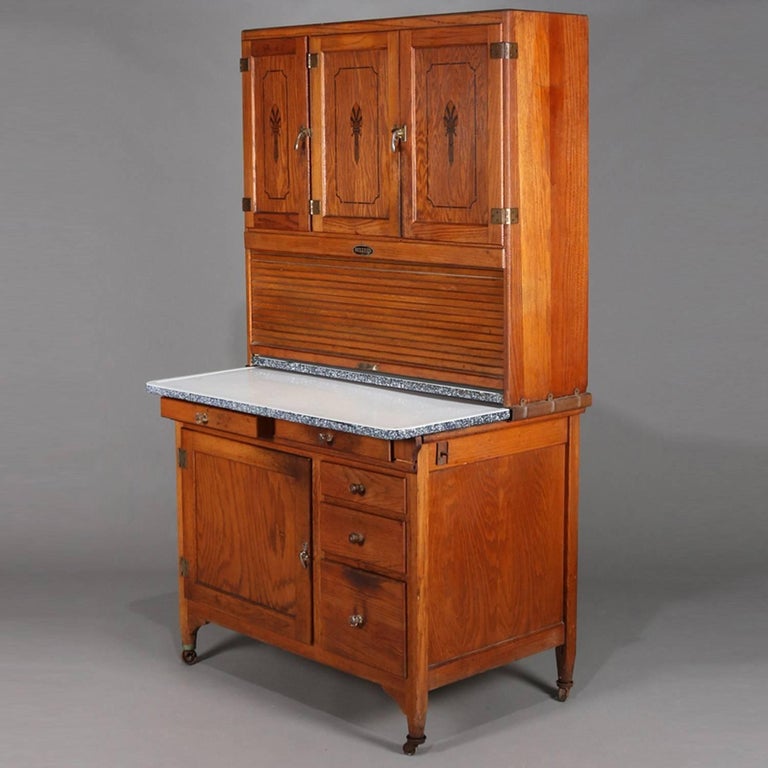 Antique Primitive Golden Oak And Enamel Hoosier Cabinet By Sellers Antique Primitive Golden Oak and Enamel Hoosier Cabinet by Sellers, circa 1920 In Good Condition - Antique Primitive Golden Oak And Enamel Hoosier Cabinet By Sellers