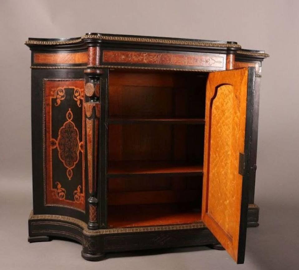 Victorian marquetry inlaid and ormolu ebonized walnut credenza is a fine and rare example of Victorian satinwood marquetry work in manor of Herter Bros. or Pottier and Stymus Co., circa 1870.

Measures  - 43"h x 54.25"w x 17.25"d