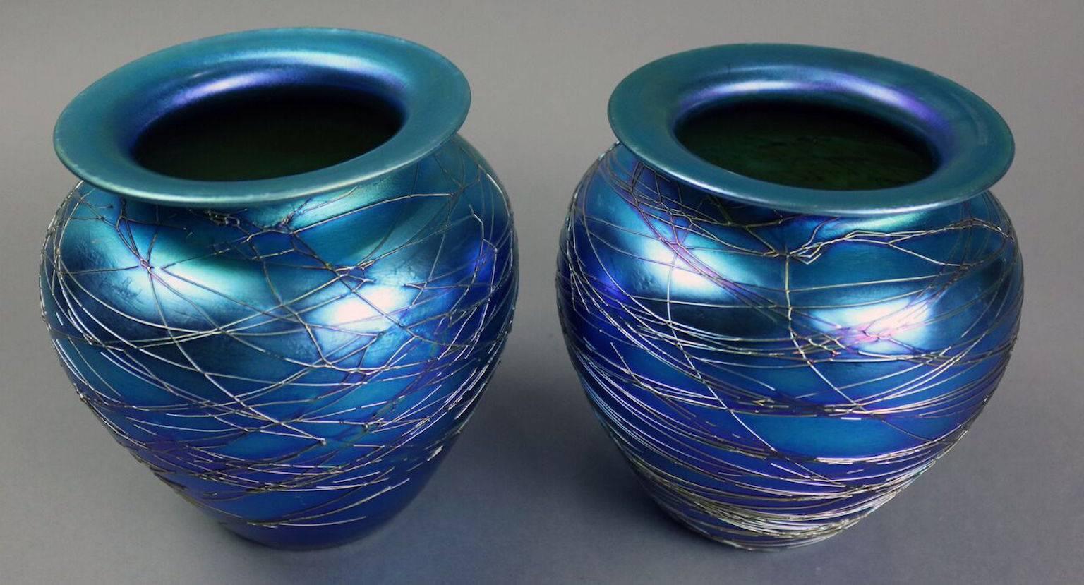 Pair of antique Durand art glass vases feature iridescent blue threaded glass, signed 