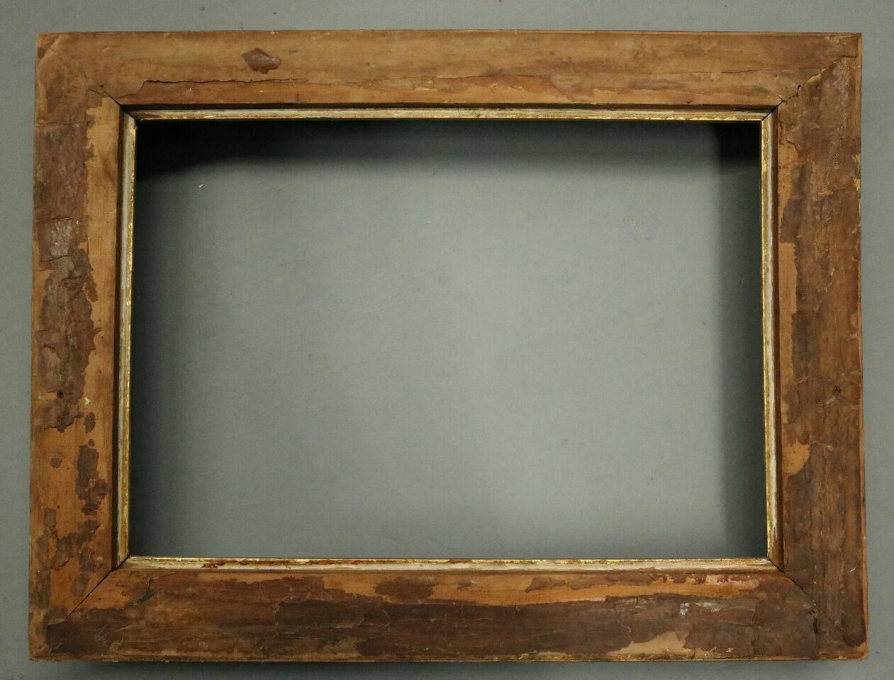 Antique gold gilt frame features first finish ornate gesso on wood foliate design, late 19th century. Measures: 26.5” x 21