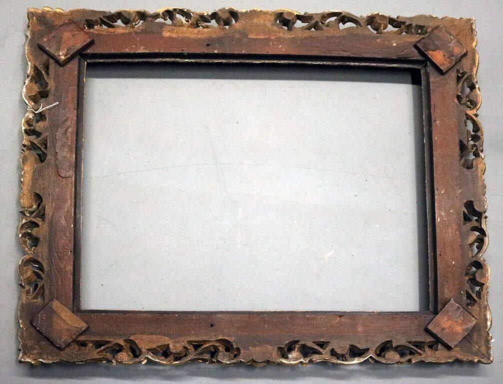 Finely carved reticulated antique Italian frame features gold gilt over foliate and scrolled carving, circa 1850. Measures: 40