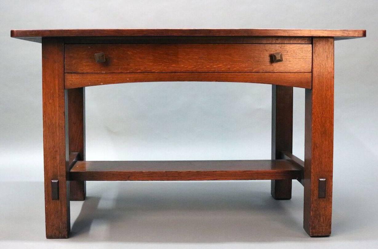 Mission oak Arts & Crafts desk by Limbert features classic period design, single drawer and brand mark, early 20th century.

Maker: Limbert, Charles P. & Company
Year: 1894 - 1944
Reference: Arts & Crafts Furniture Design: The Grand Rapids