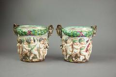 Pair of Figural Capodimonte Hand-Painted Open Urns with Cupids, Crown N Mark