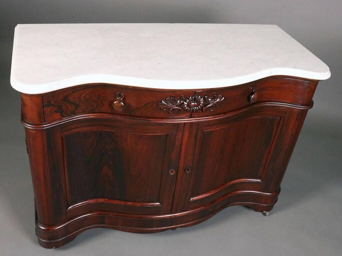 J. & J. W. Meeks Victorian rosewood commode features marble top, serpentine front, single divided drawer, double doors opening to compartment with singe shelf, chamfered back panels, and back stamp reading "J. & J. W. MEEKS MAKERS N214
