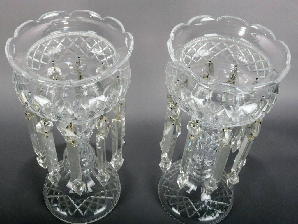 Pair Victorian mantel lustres feature cut crystal pedestal vases and hanging prisms, late 19th century.