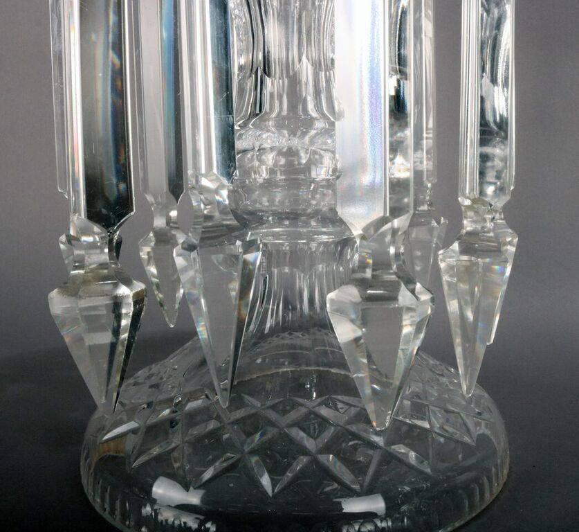 Pair of mantel lustres feature tall cut crystal pedestal vases decorated with longer prisms, late 19th century.