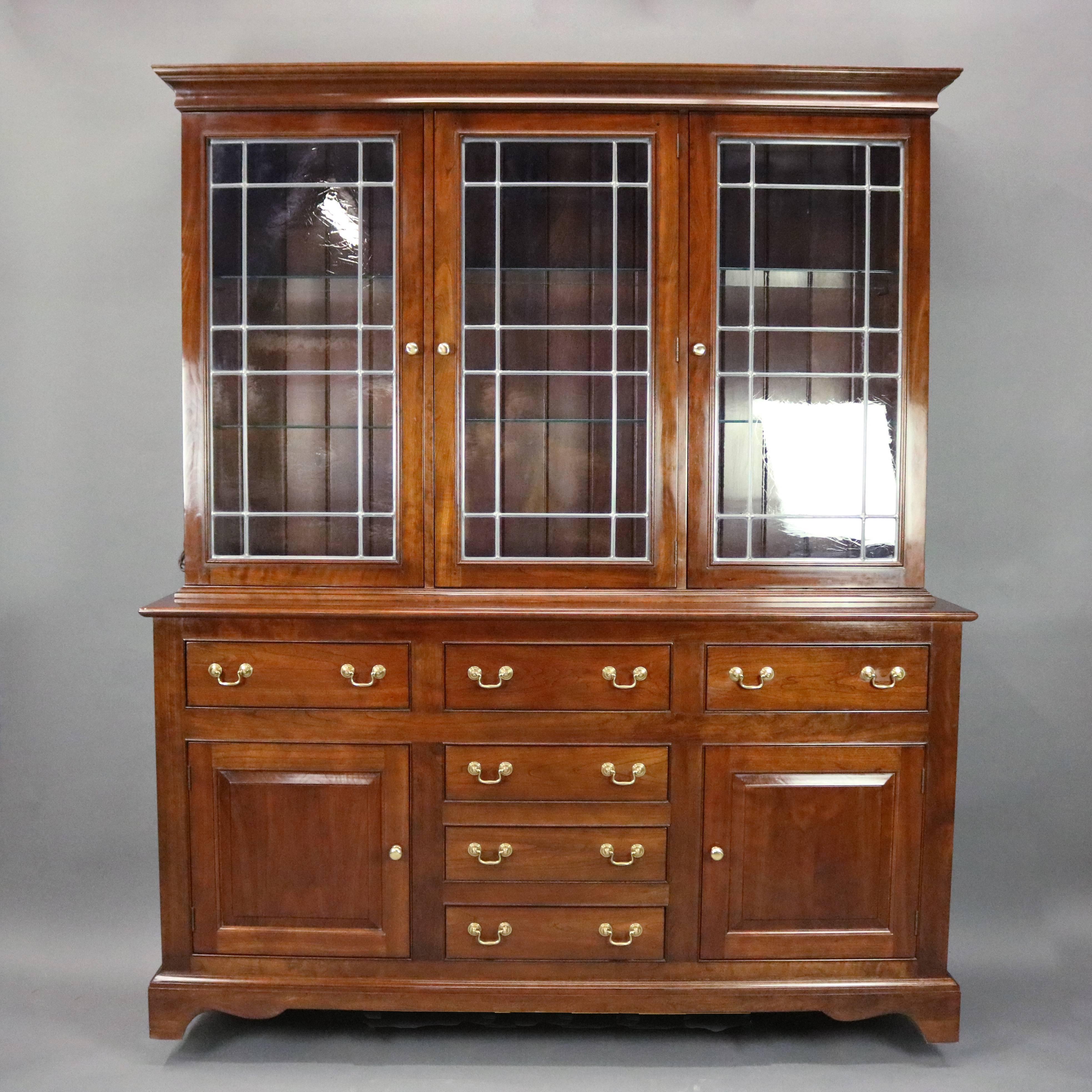 Vintage L. & J.G. Stickley Cherry Valley Collection two-piece breakfront features solid cherry construction with six drawer and two door lower cabinet below three door glass display upper, circa 1985

Measures: 81" H x 87.5" W x