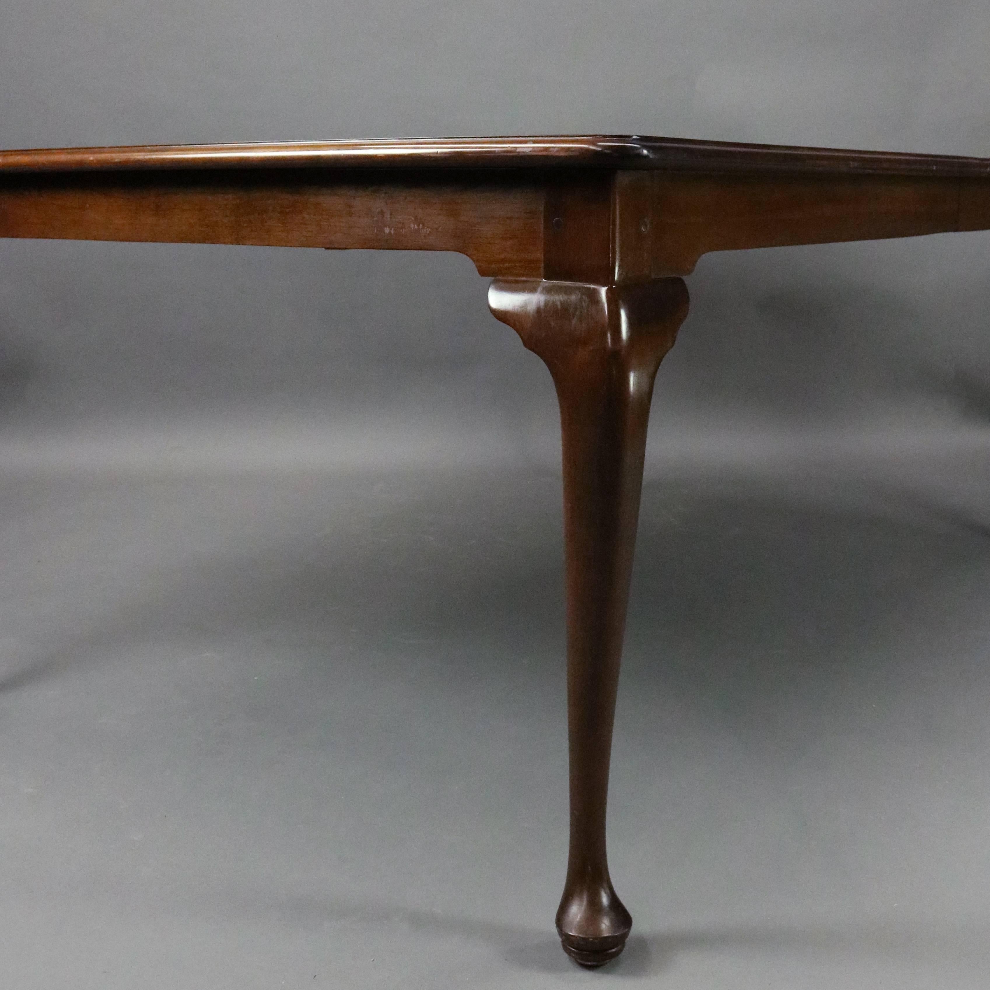 L. & J.G. Stickley Cherry Valley collection dining table features solid cherry construction, Queen Anne style legs, four leaves extending to 10ft, circa 1985

Measures: 30" H x 72" W (at smallest) x 49" D; 12" each,