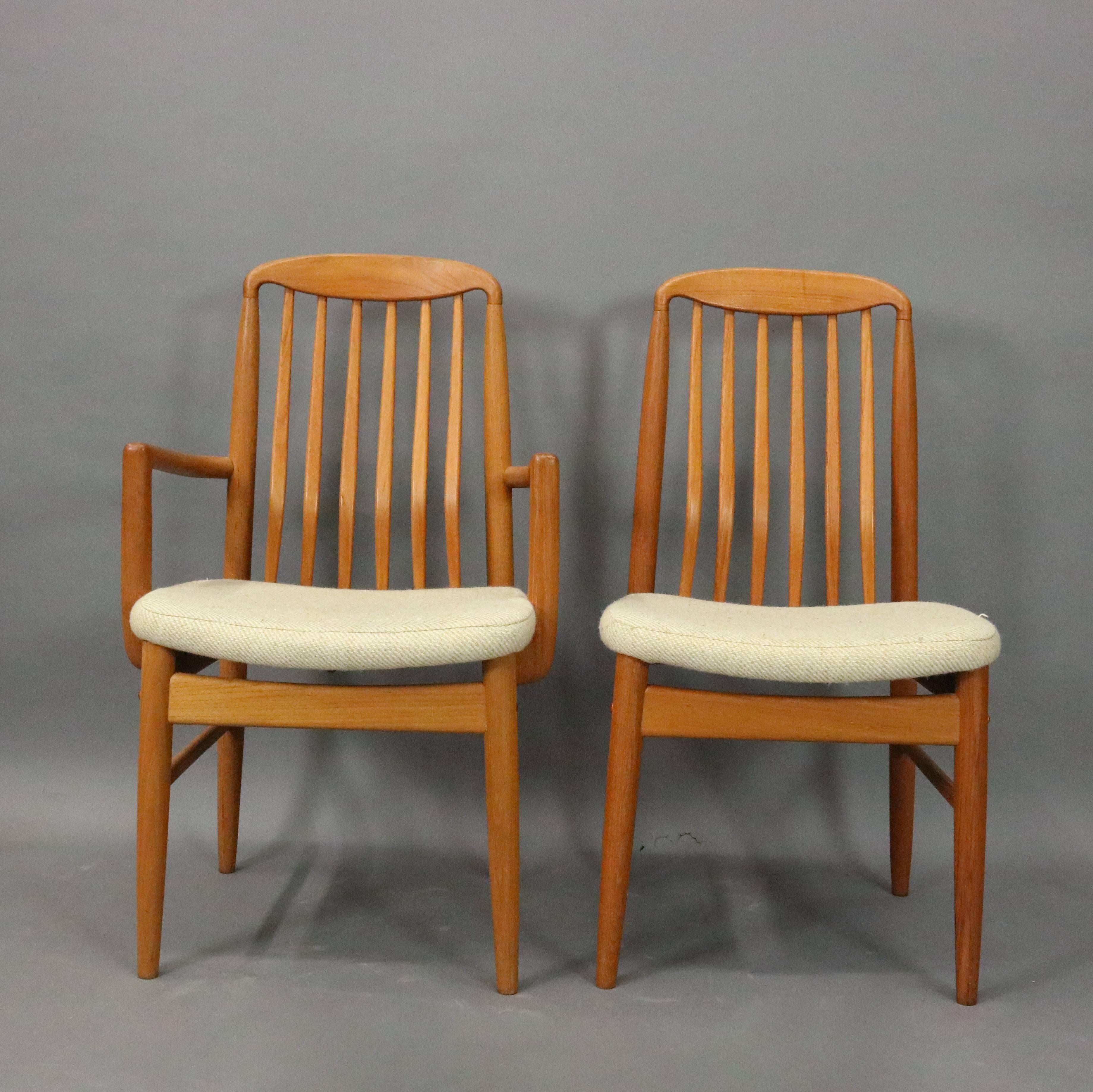 Mid-Century Danish Modern teak dining set includes expandable table (two leaves) and six upholstered slat back chairs, circa 1960

Measures: 29