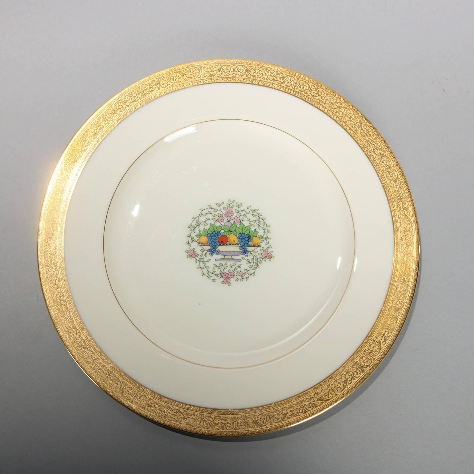 14 vintage Lenox China porcelain plates made for Ovington Bros., New York, feature central Corbeille a Fleurs (flower basket) with gold gilt rim, 20th century.

Measure - 10.25" diam.