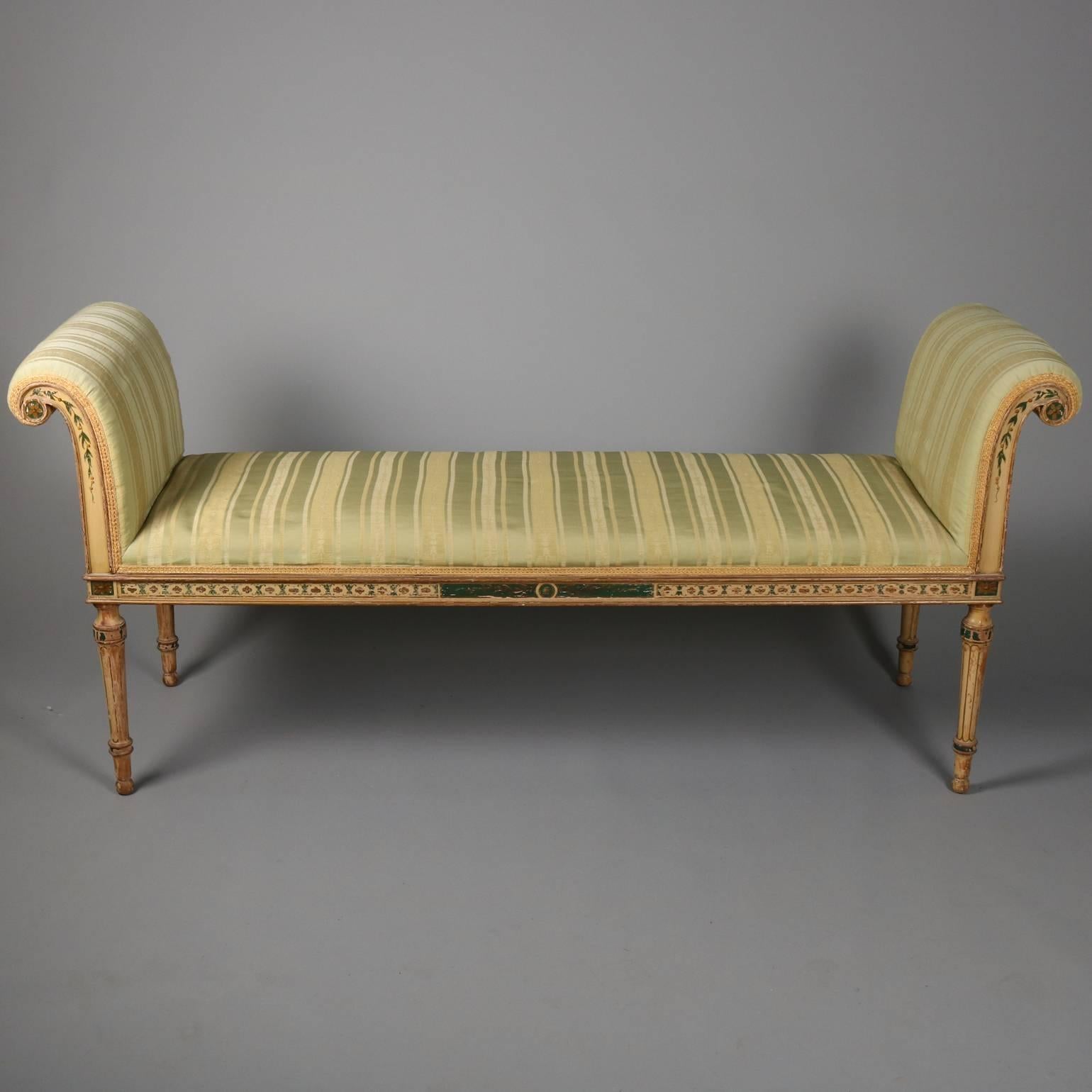 Antique Continental Italian Venetian upholstered window bench features hand-painted and stenciled foliate decoration, scrolled arms and tapered legs, circa 1880

Measures: 29