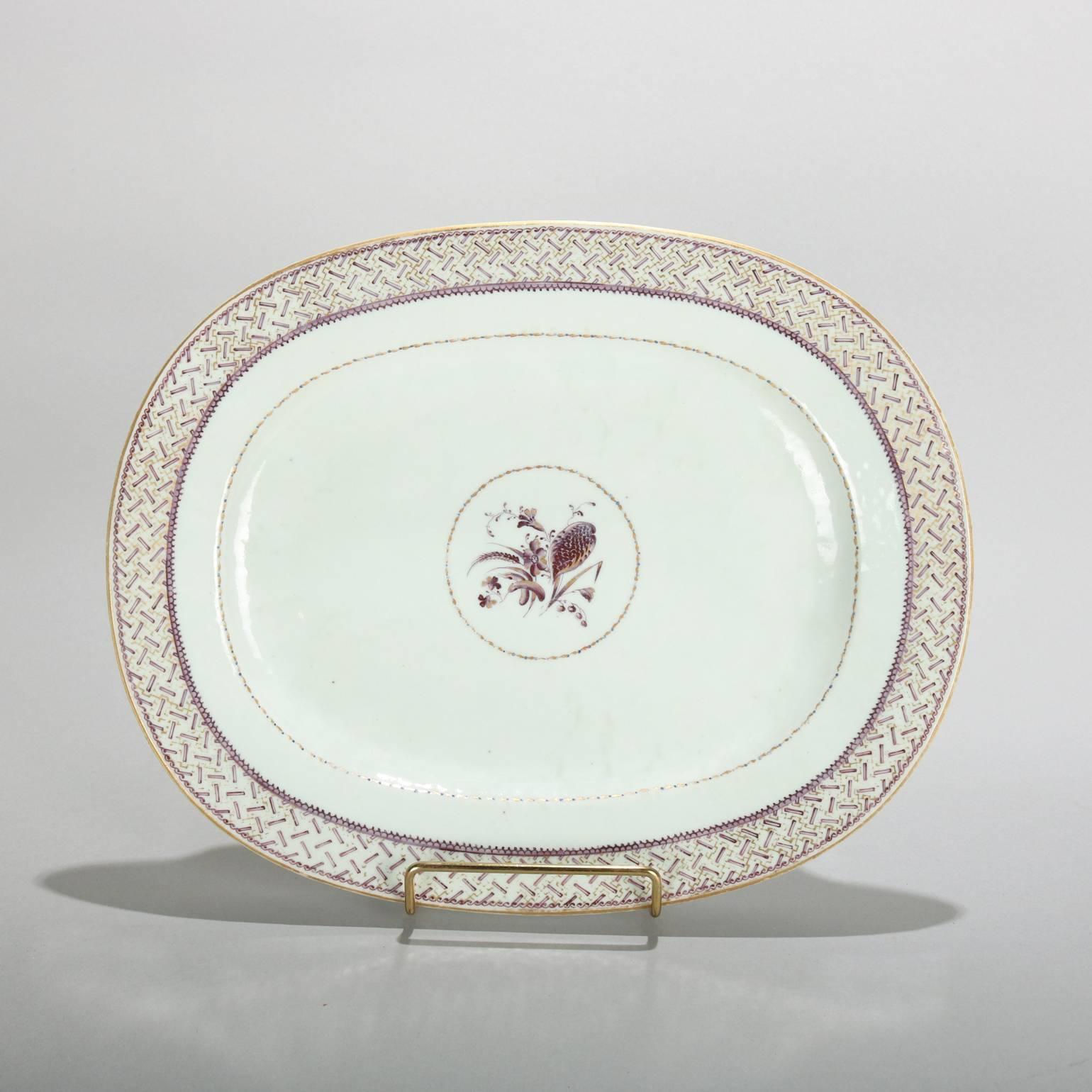 Pair of Chinese Export Lowestoft antique porcelain platters feature lavender and gilt central barley pattern with basket weave pattern on rims, en verso label reads Oriental Lowestoft, early 19th century.

Measures: 1" H x 12" W x