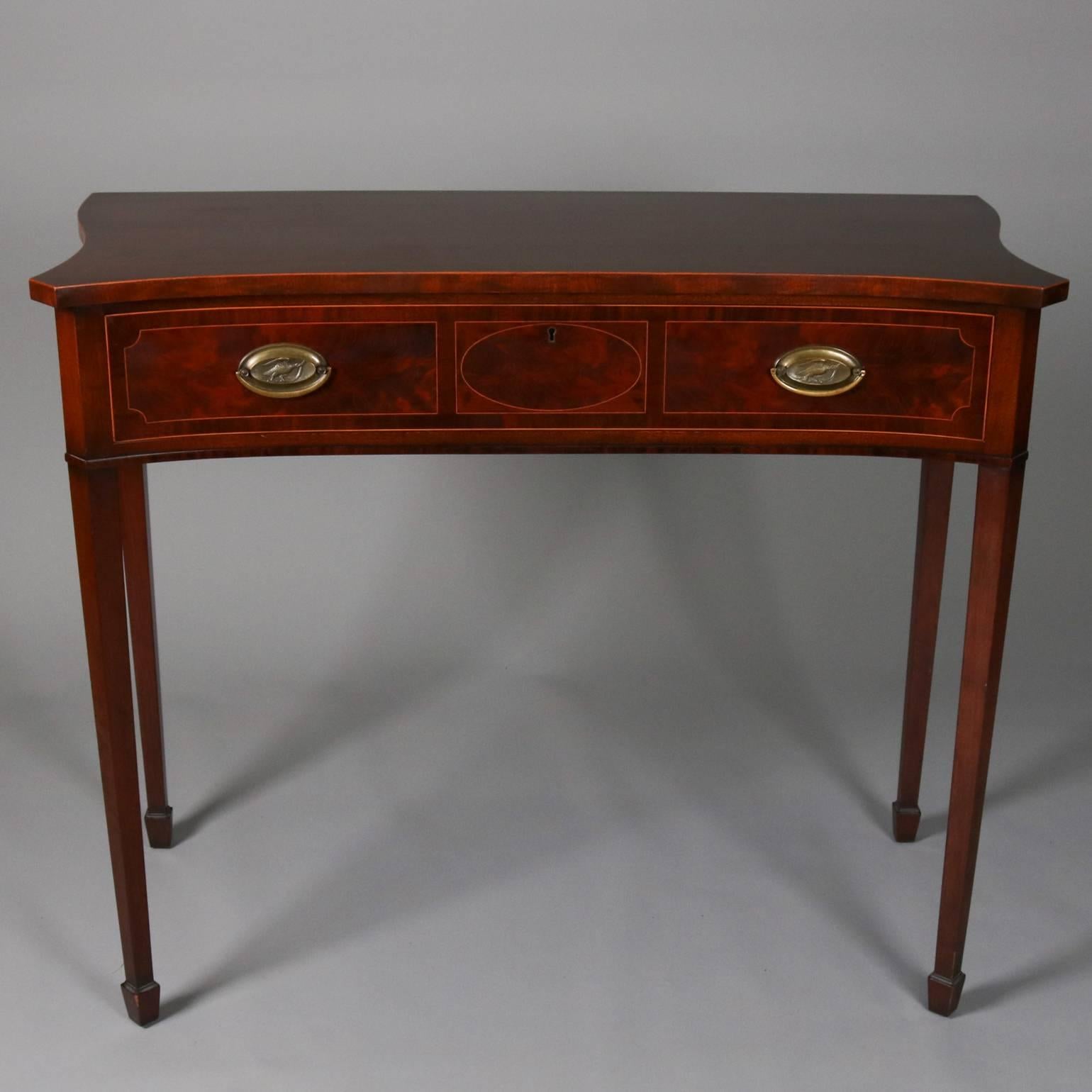 Antique English flame mahogany Hepplewhite School server features satinwood banding on top surface and front, bronze pulls, tapered legs terminating in spade feet, 19th century

Measures: 36" H x 44.5" W x 21" D.