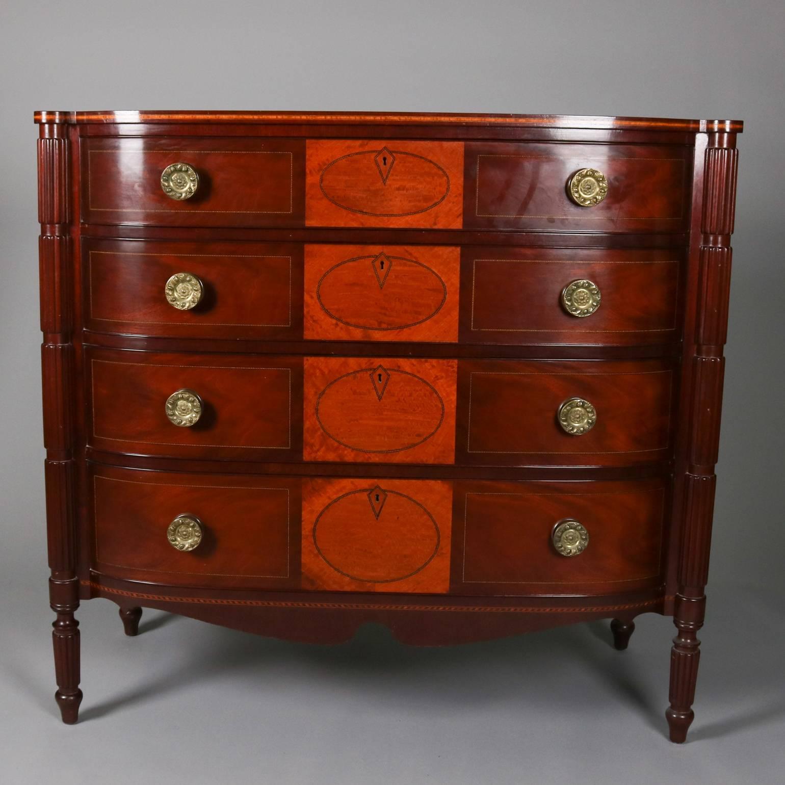 Antique English Sheraton flame mahogany bow front four-drawer chest features burl inset reserves banded in alternating satinwood and ebonized inlay, satinwood banding throughout, case flanked by broken reeded columns, circa 1840

Measures:
