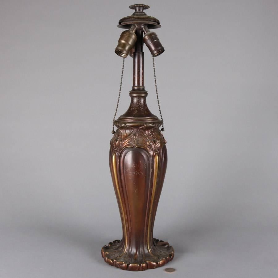 Antique Art Nouveau Bradley & Hubbard three-socket lamp base features cast bronze construction with foliate decoration and gilt highlights, circa 1920

Measures; 24.5" height x 7" diameter (base).