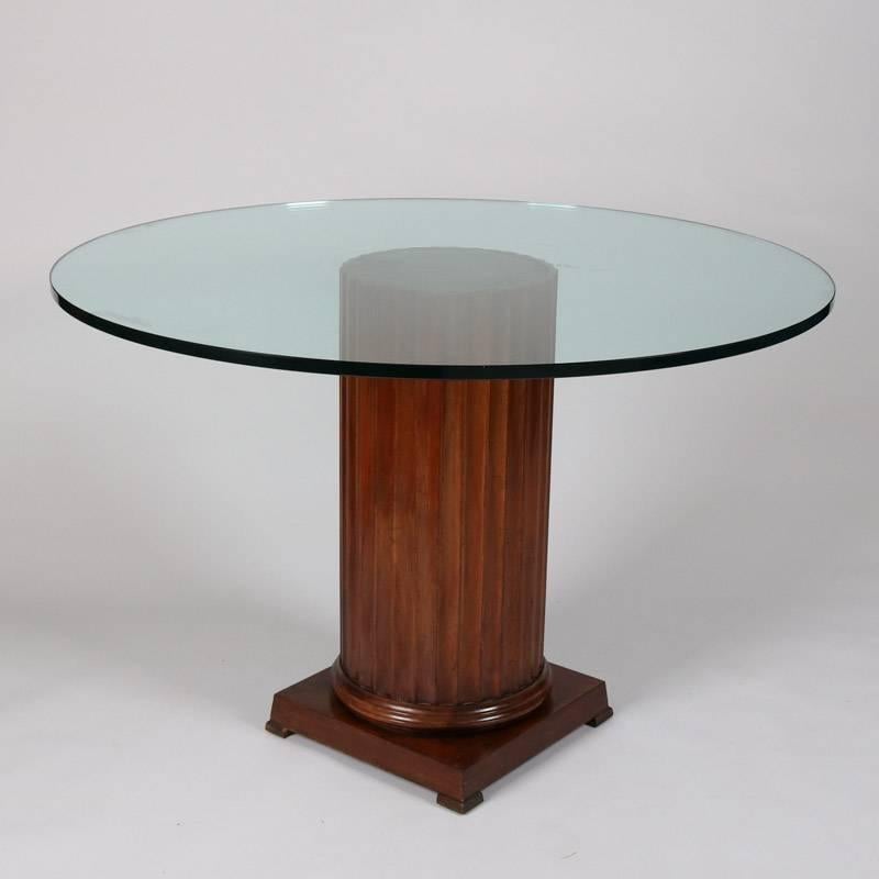 Classical glass top dining table features carved Corinthian column base, 20th century

Measures: 32