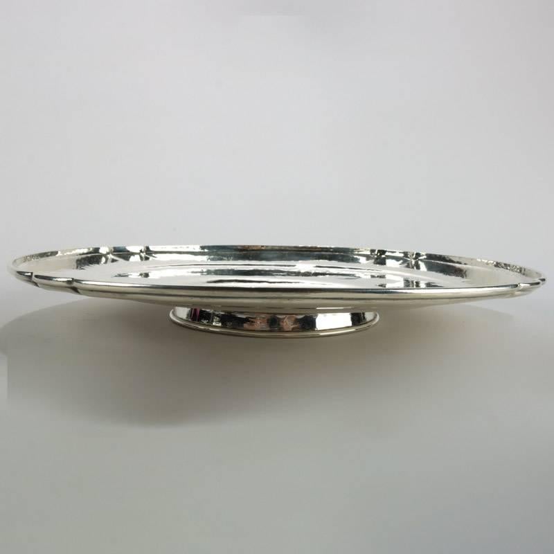 Antique Arts & Crafts hand-wrought sterling silver footed tray by Falick Novick, school of Tiffany or Kalo, Chicago, central monogram "CSW", en verso stamp, 25.82toz

Measures: 1.5" height x 12" diameter.