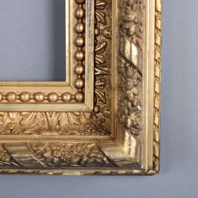 Antique carved giltwood frame features foliate, floral and beaded decoration, 19th century

Measures: 27.5" x 23" x 3.5", framed; 21" x 16.5", sight.