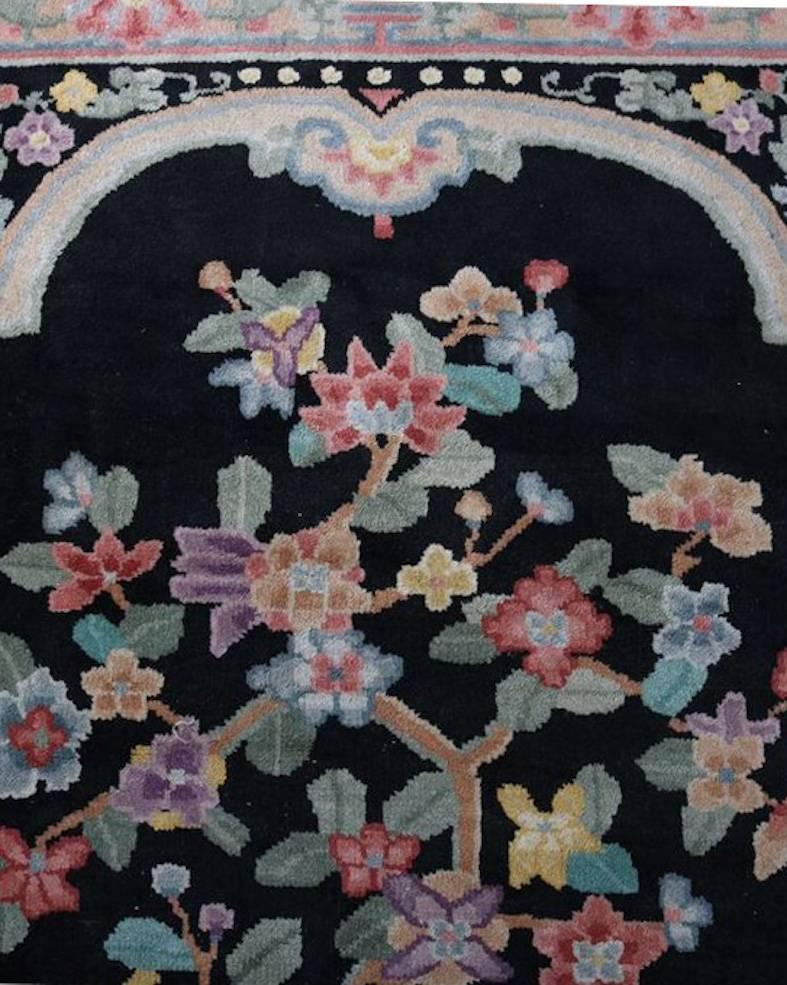 Antique Chinese Nichols oriental carpet features floral bonsais potted in jardinieres with dragon at base, 20th century

Measures: 100