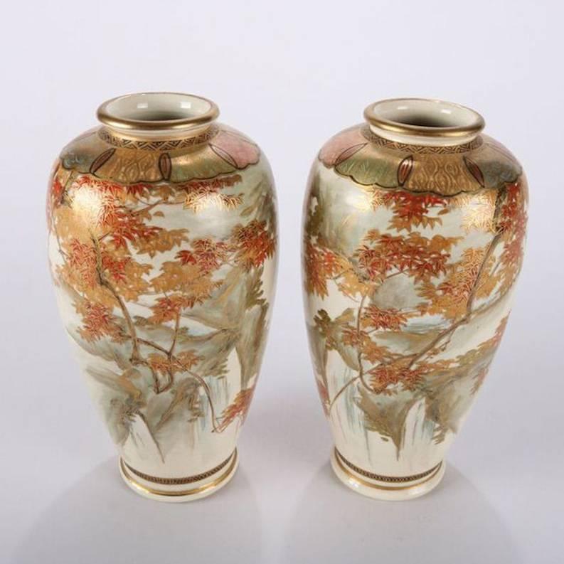Pair of petite Chinese hand-painted and gilt Satsuma style art pottery vases with foliate motif and ornate collar, marked Formosa (Taiwan) with chop marks on base

Measures -  7.25" h x 1.25" op x 2.25" bs