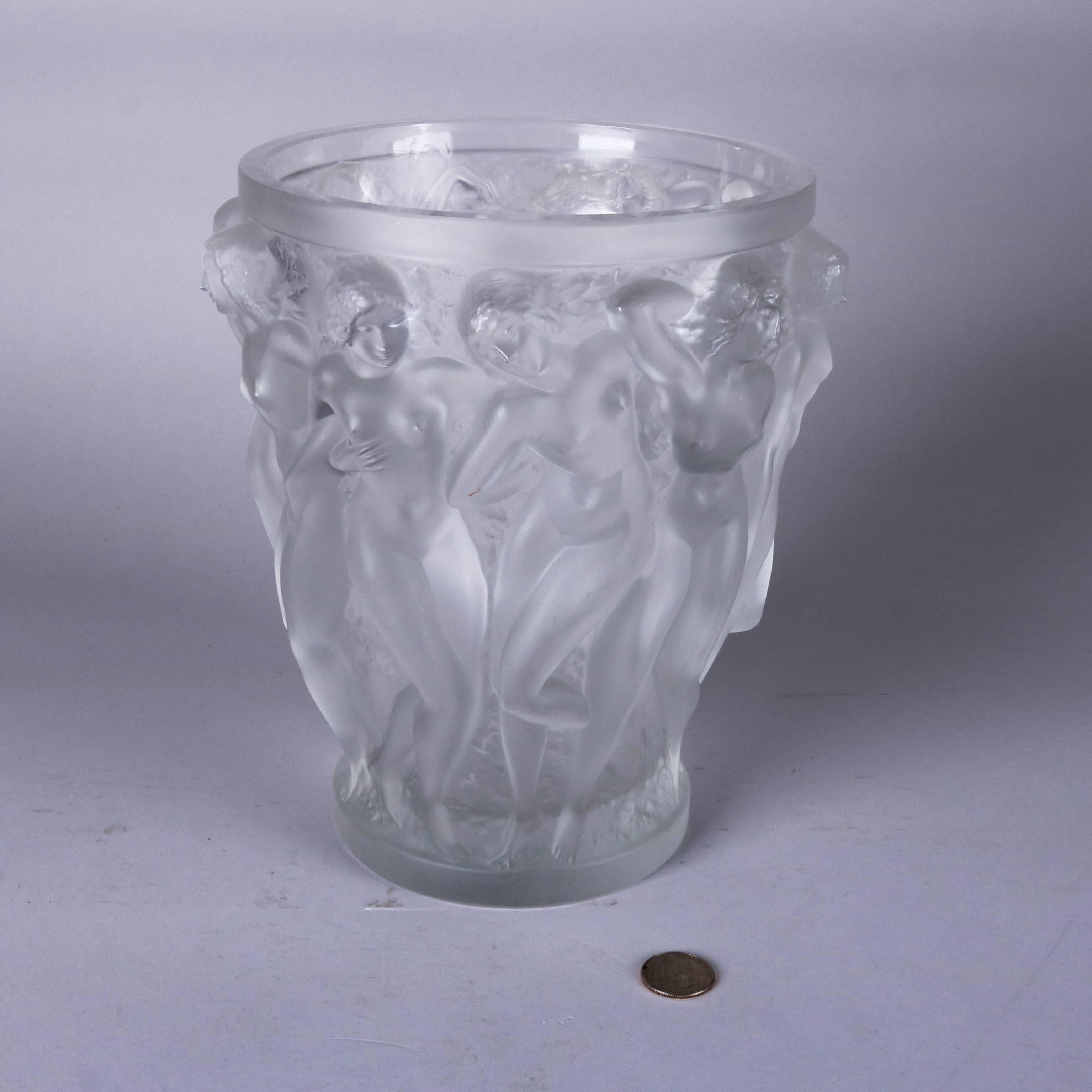 Lalique lead crystal "Bacchantes" vase features high relief of women in dance "Lalique crystal FRANCE"

Measures: 9.75" H x 9" W @ W, 6.5" op, 5.25" bs.