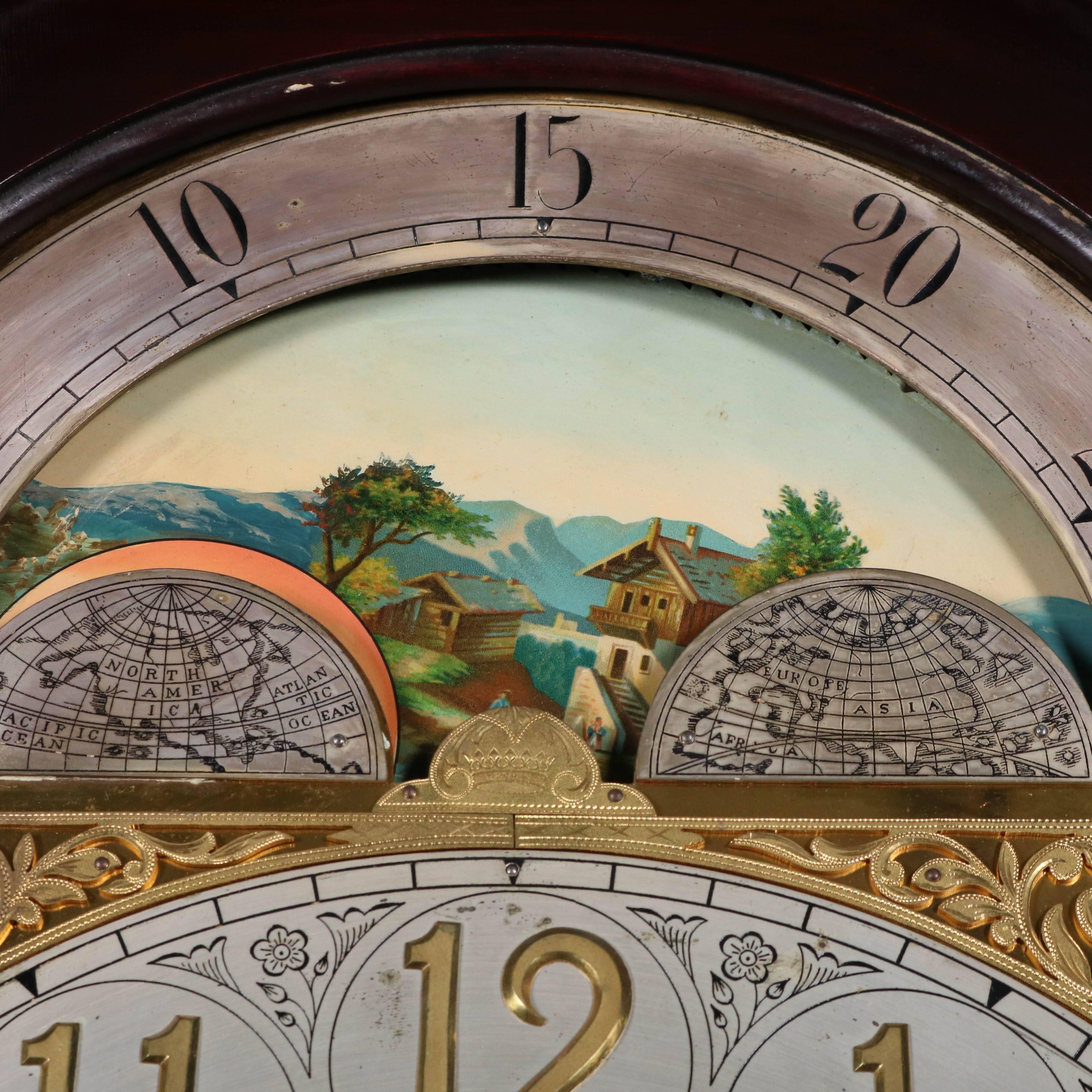 Antique Herschede tall case clock features mahogany case with satinwood inlay, heavily adorned moon phase face with mountain scene, deep and rich chime, includes key and pendulum, early 20th century

Measures: 88" H.