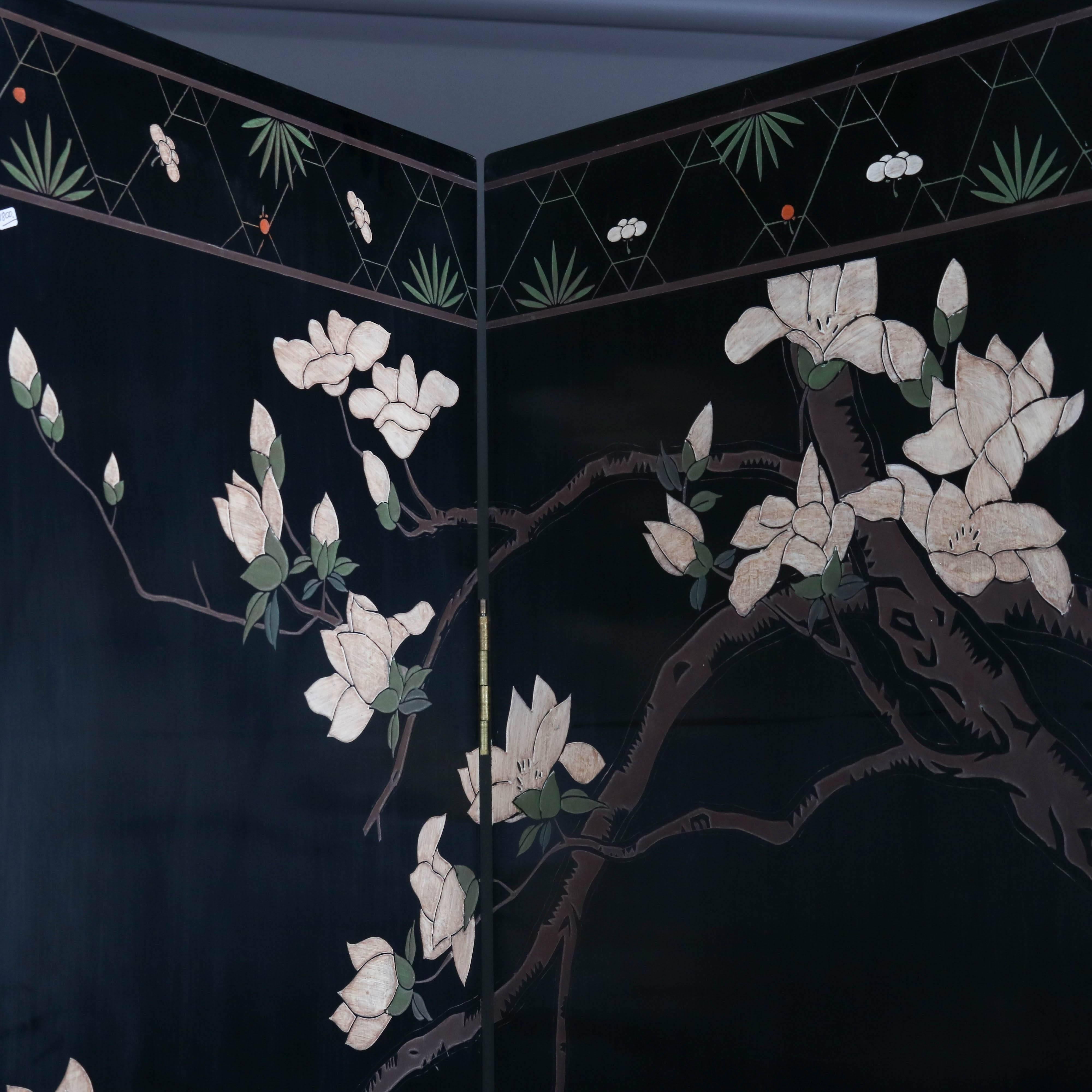 Carved Chinese Coromandel hand-painted ebonized dressing screen features four panels with scene with villagers in daily activities within and amongst pagodas, en verso garden scene with flowers and birds, 20th century.

Measures: 72.5" H x