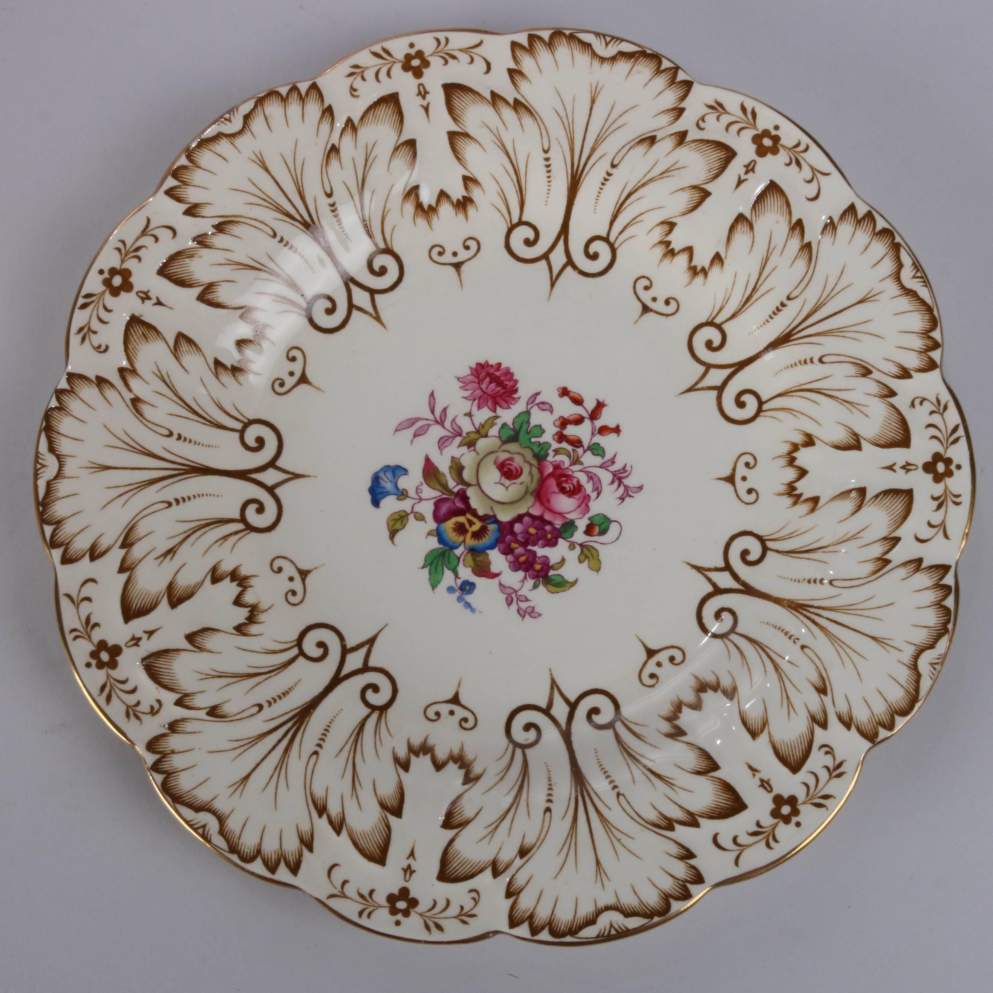 Vintage set of 12 Royal Cauldron english porcelain dinner plates feature central floral bouquet with gilt stylized foliate rim.

Measures: 9" overall, 5" serving.